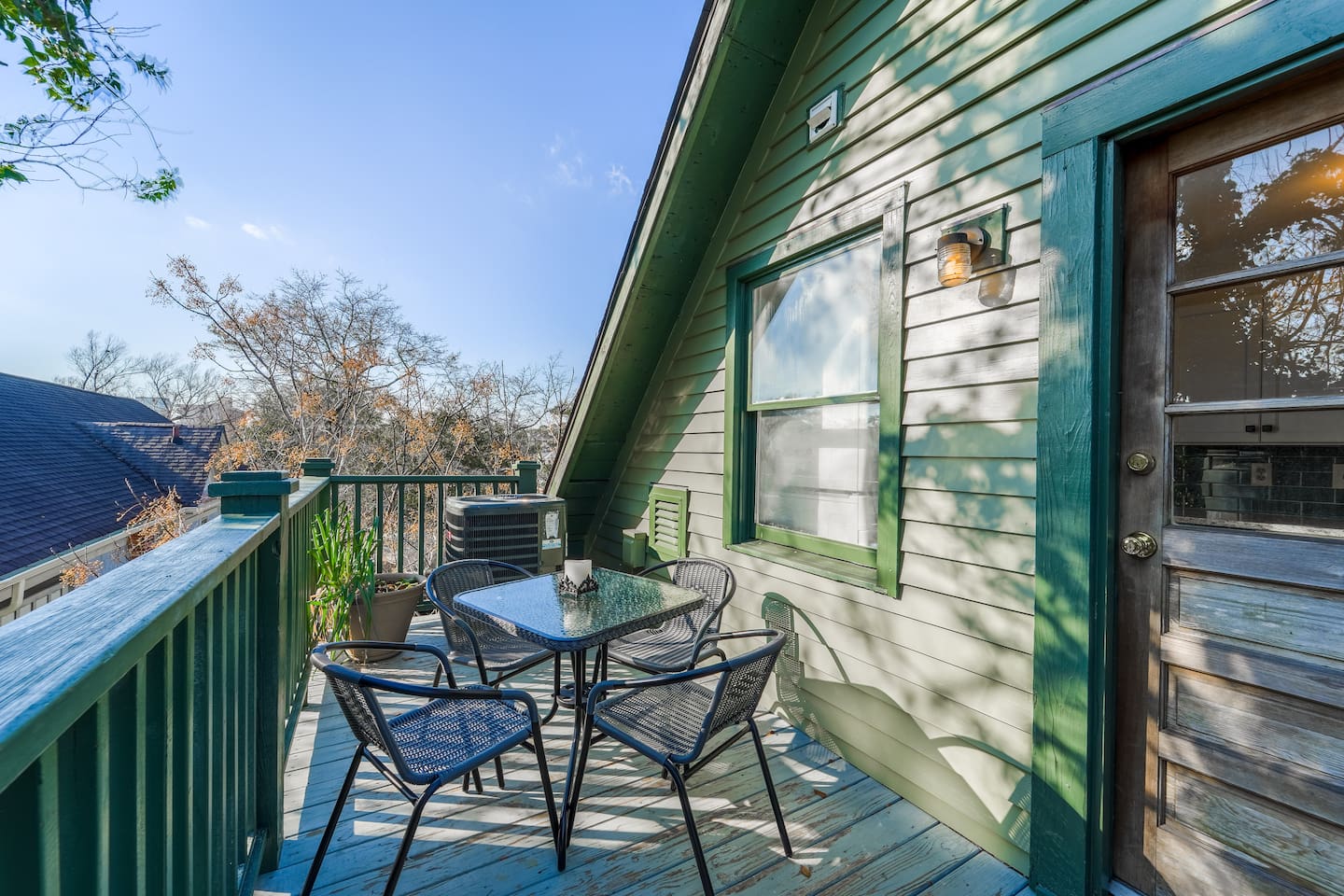 Located right off of the kitchen, enjoy the lovely  view. Feel free to enjoy breakfast al fresco! Being on the top floor, feels like you are sitting in a treehouse! 