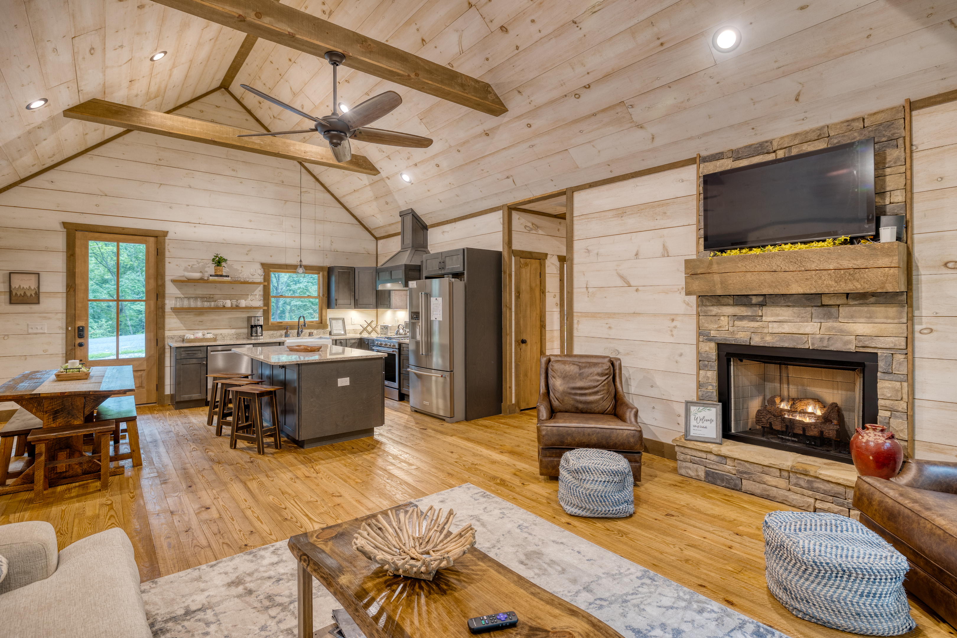 View of kitchen from living room and gas fireplace