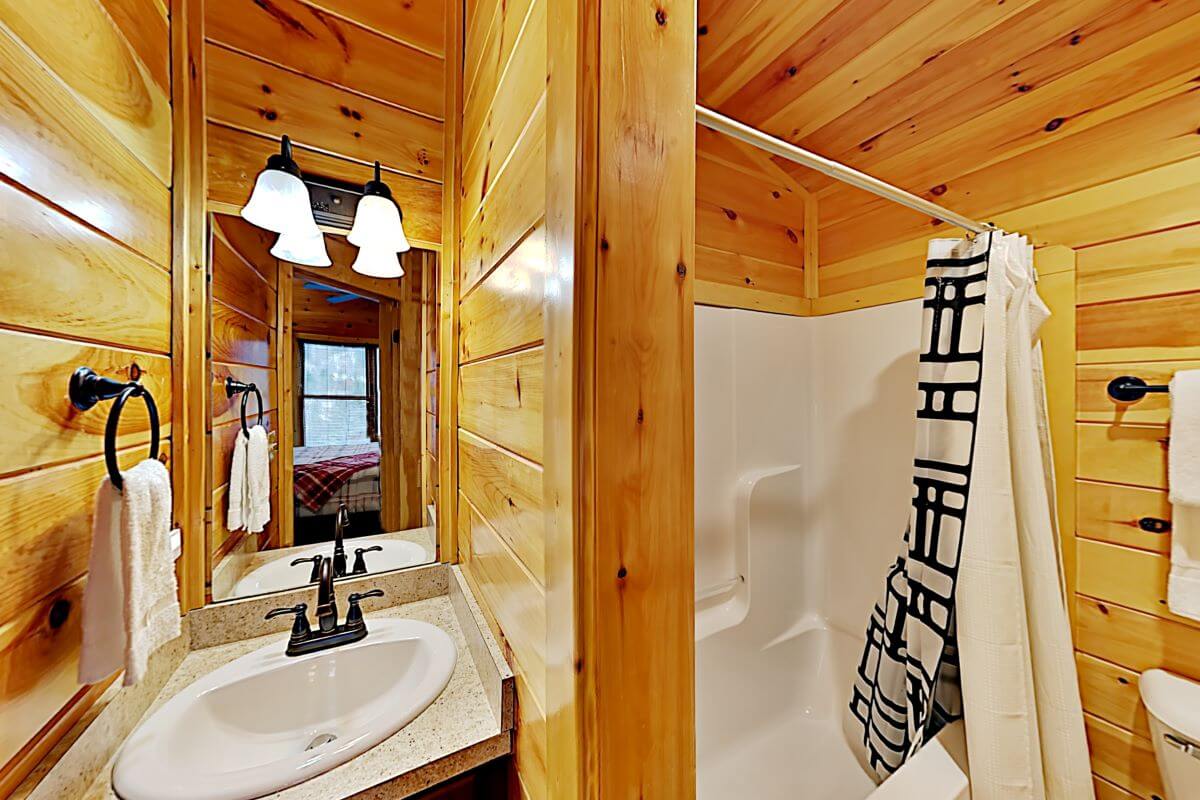 One of the four full bathrooms off a bedroom.