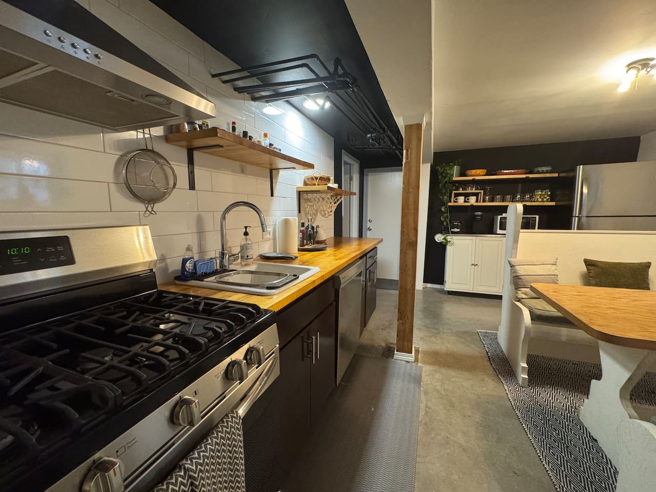 Lower-level kitchen fully equipped for cooking and entertaining— one of two kitchens  in this spacious 3-bedroom, 2-bath home. Ideal for family and groups.