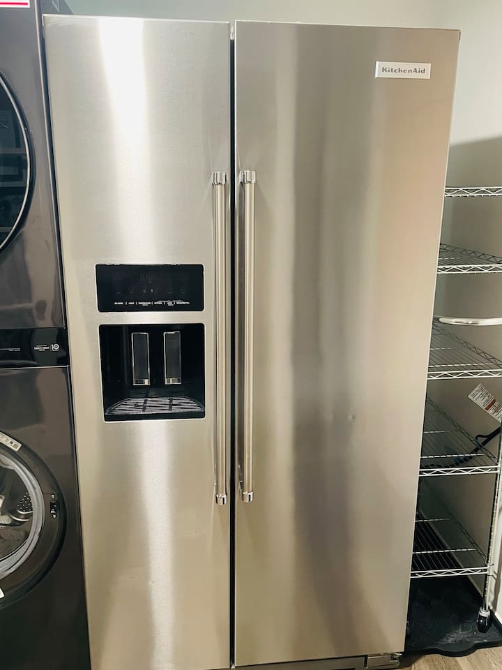 A full-sized side-by-side refrigerator and freezer keep everything organized and easily accessible for your stay.