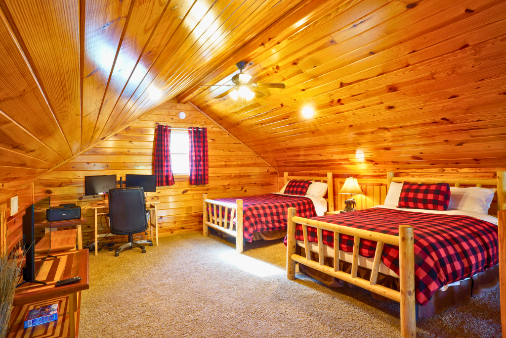 Loft sleeping area with 2 full beds + full pull-out sofa — perfect for kids or extra guests.