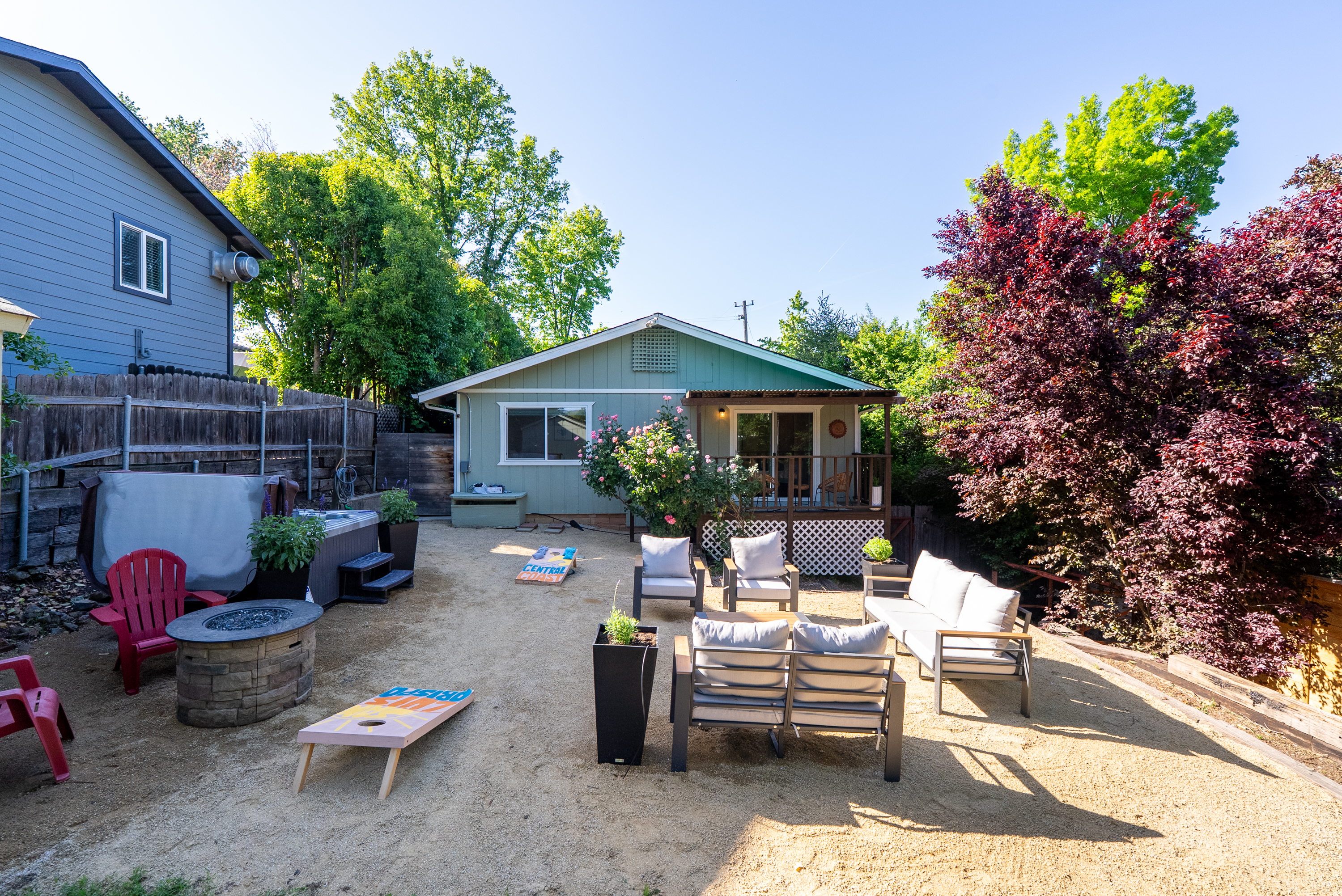 Cozy seating and outdoor fun in a peaceful garden setting.