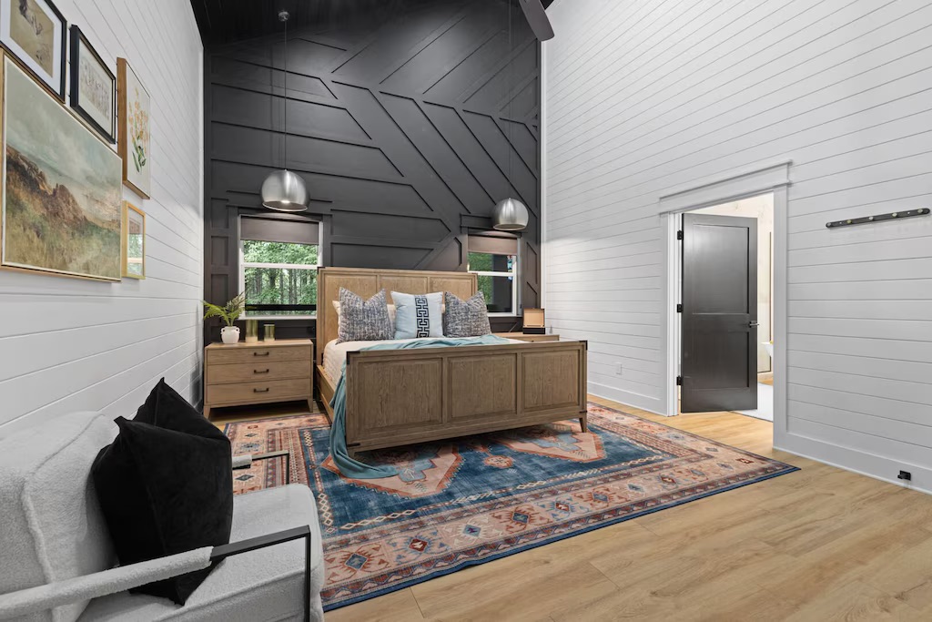 Master Bedroom: Stylish retreat with large windows, rich textures, and serene woodland views!