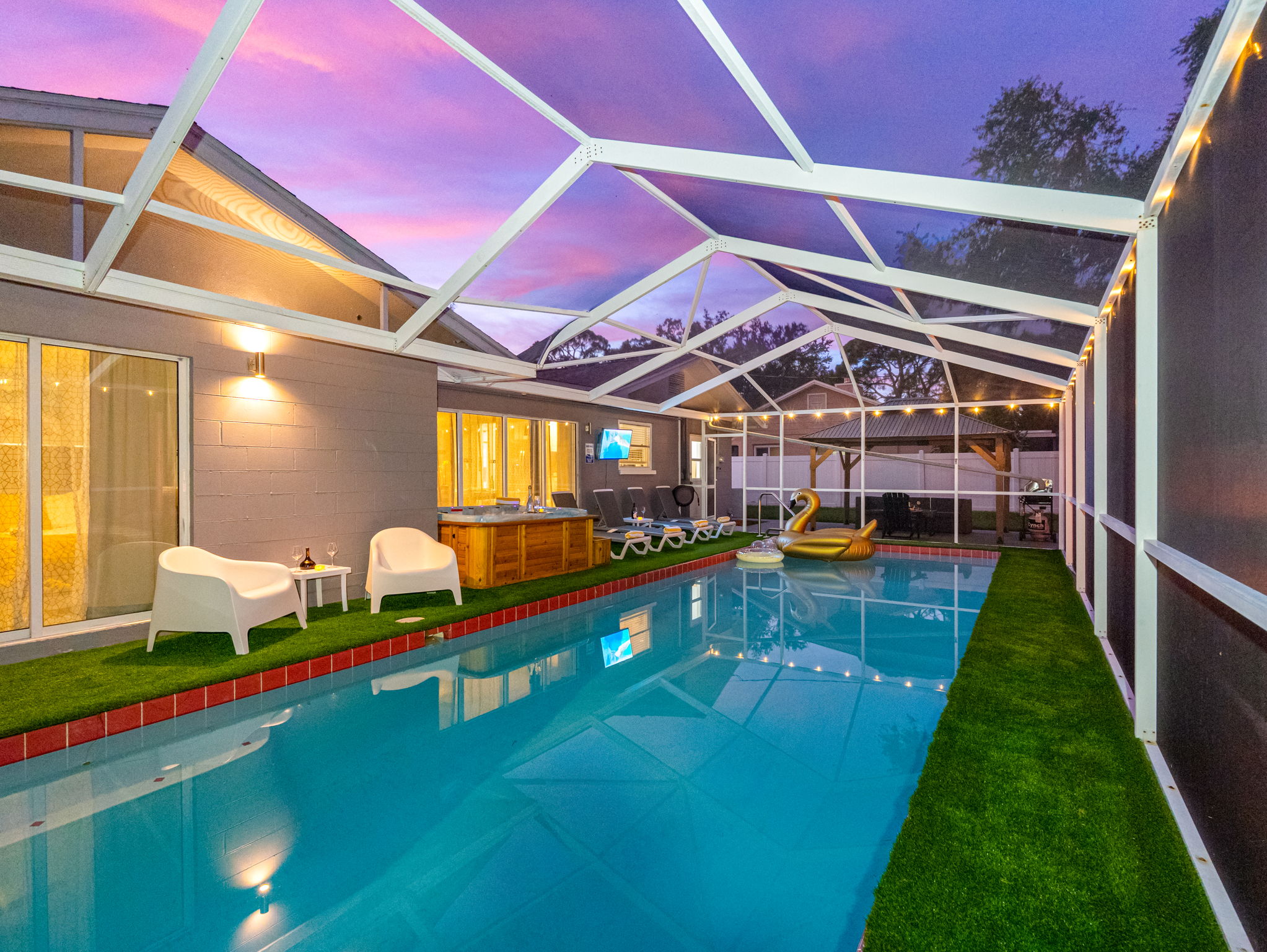 Protected from the elements and buzzing insects, the screened enclosure ensures you can enjoy this space comfortably anytime.