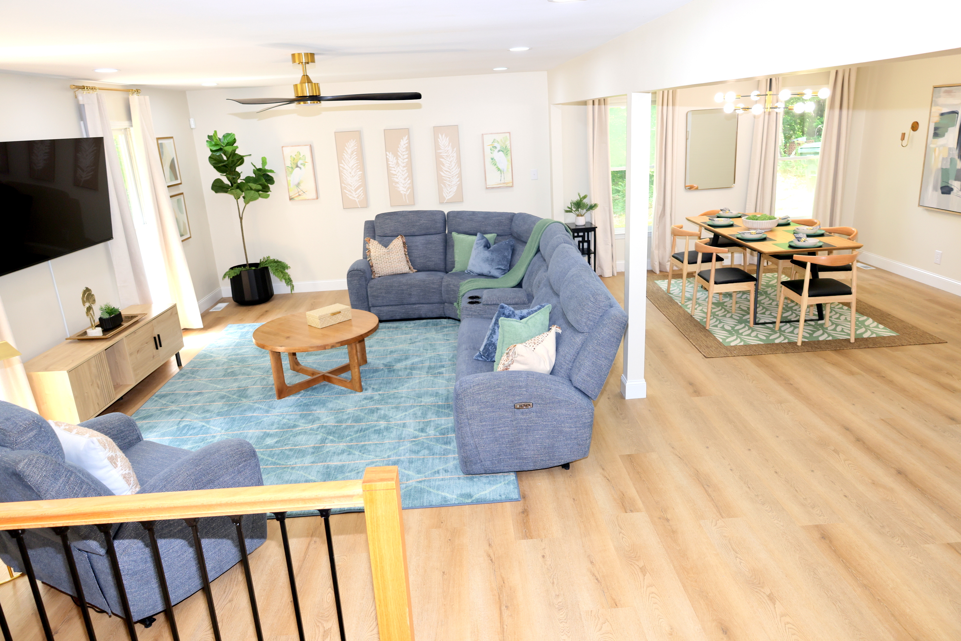 Bright open living and dining area with comfortable seating and plenty of space to gather