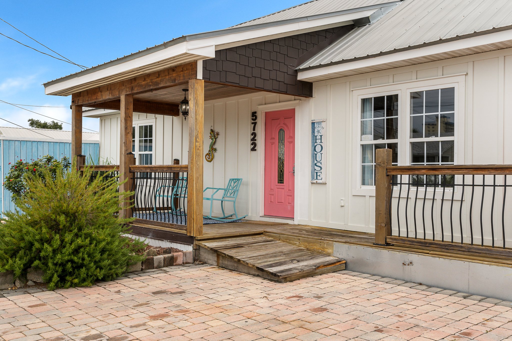 Pink door, teal rockers, porch seating
