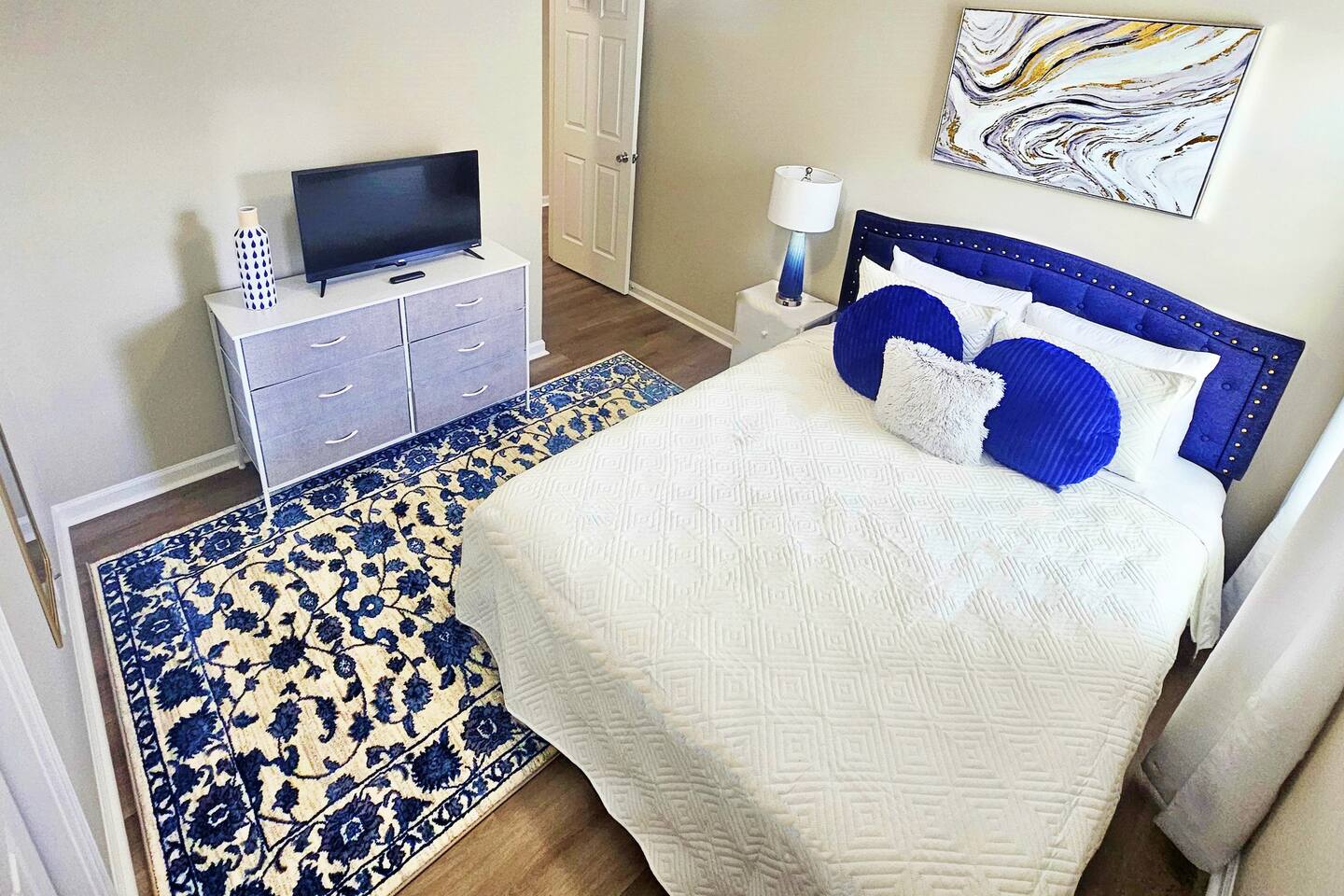 Enjoy this simple and calming guest queen bedroom. Perfect for 2. 