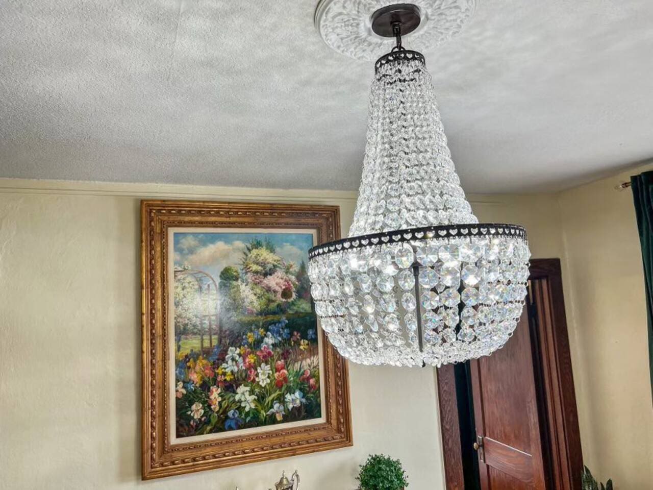 Elegant chandelier hanging above the dining table, adding a touch of sophistication and ambiance to your meals.