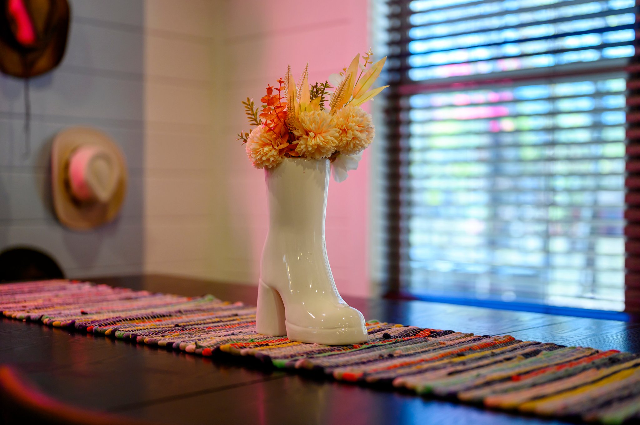 The centerpiece of the dining table – a unique cowboy boot vase that adds a touch of western charm.