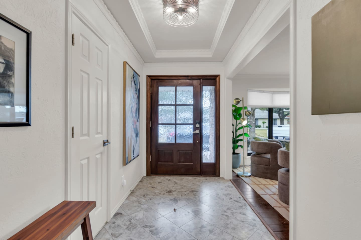 Elegant entryway that sets the tone for the home, featuring a welcoming design and a smooth transition into the open living spaces beyond.