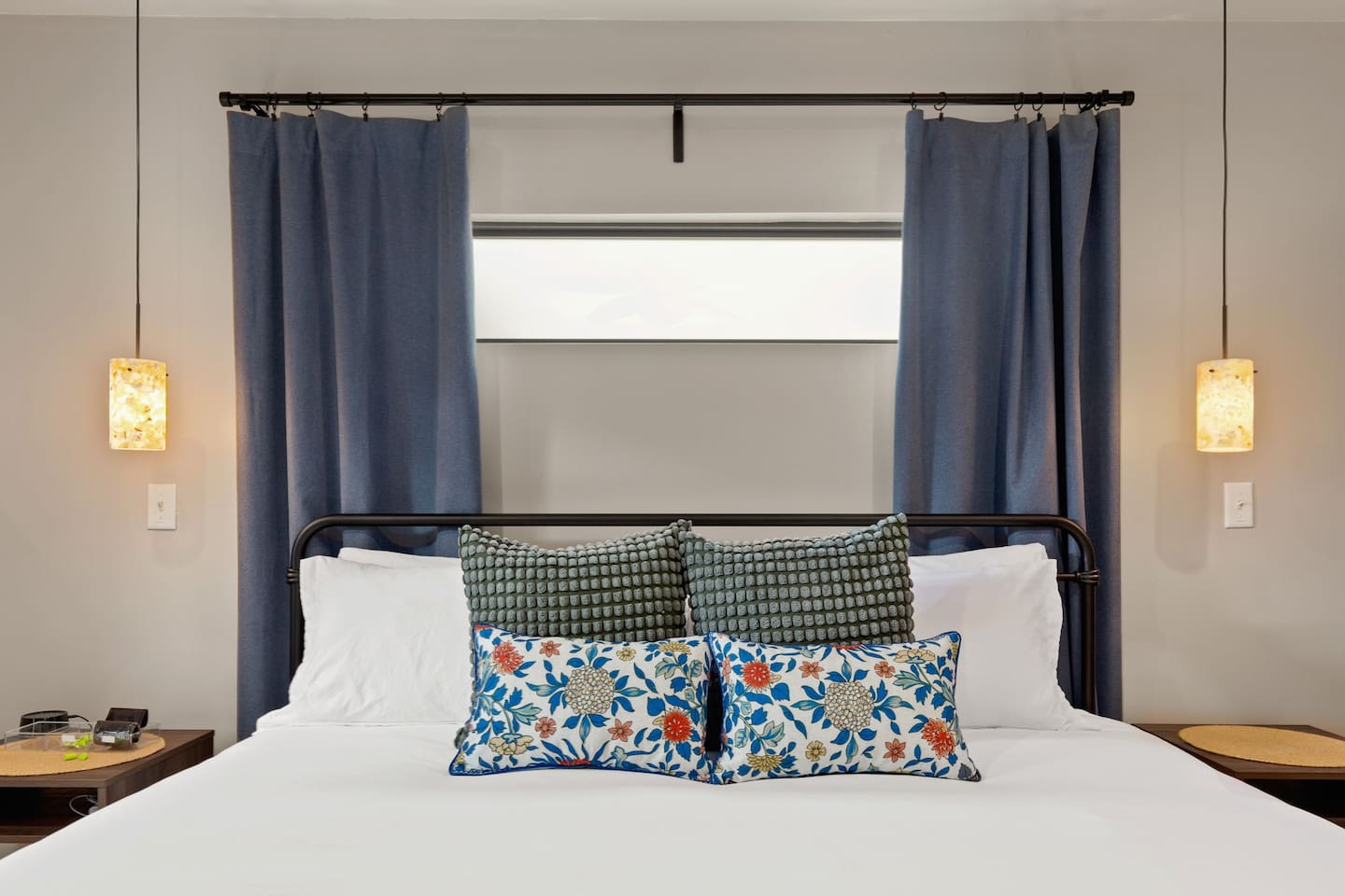 Peaceful primary suite with soft lighting and patio access ideal for slow mornings or restful nights.