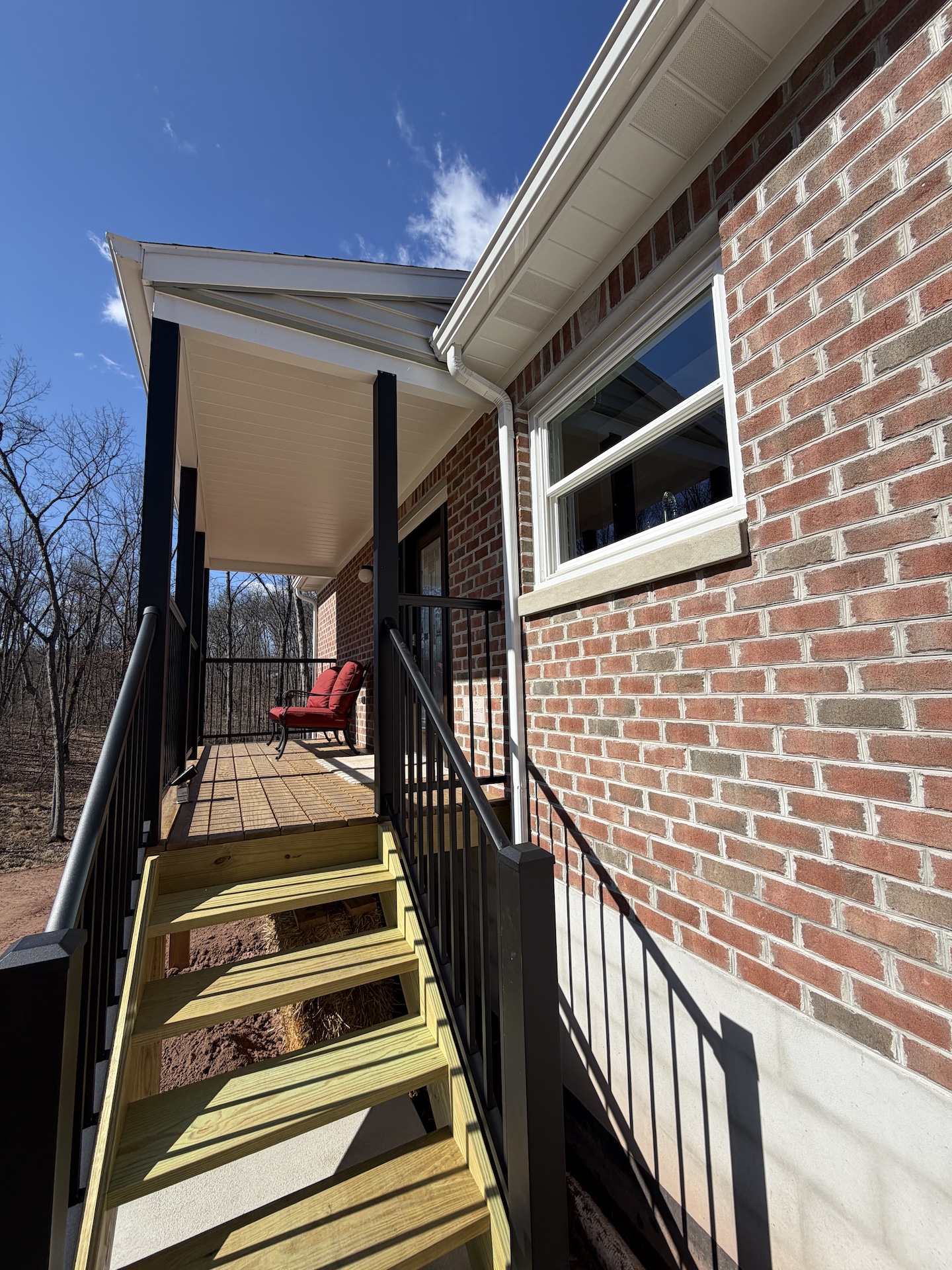 A few steps up to the porch where entrance is