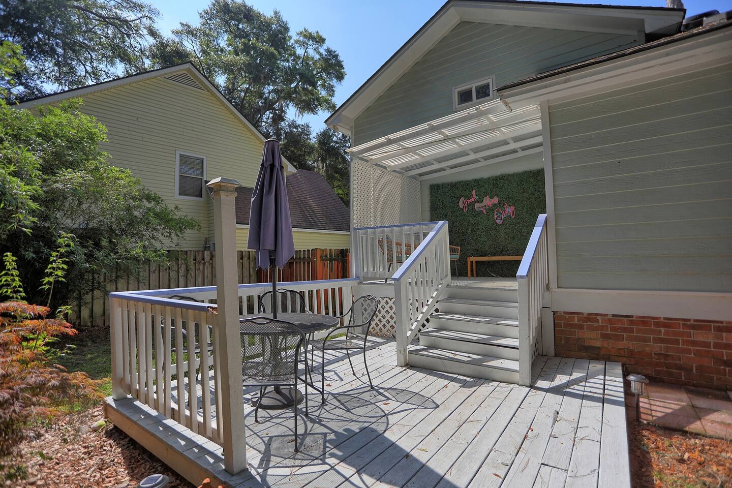 Unwind on the rear patio, a cozy spot perfect for enjoying your morning coffee or an evening glass of wine.