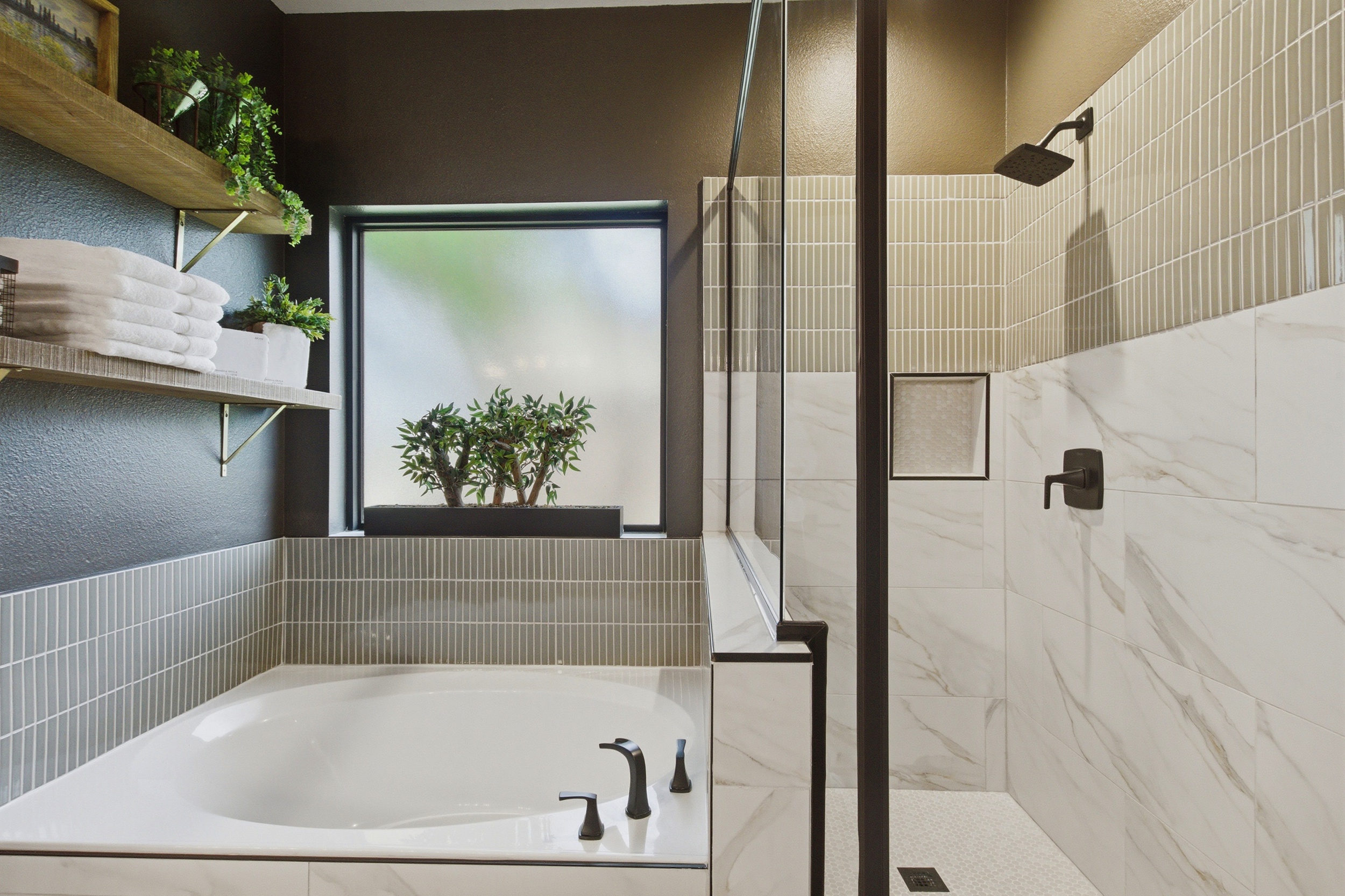 Master Bathroom featuring a large garden Bathtub alongside a separate stand-up Shower with marble tile. Stocked with essentials by Ginger Lily Farms for a spa-like soak after exploring Frisco.
