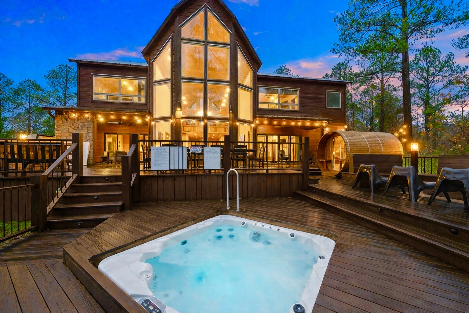 Sunken hot tub, barrel steam sauna and fire table. 