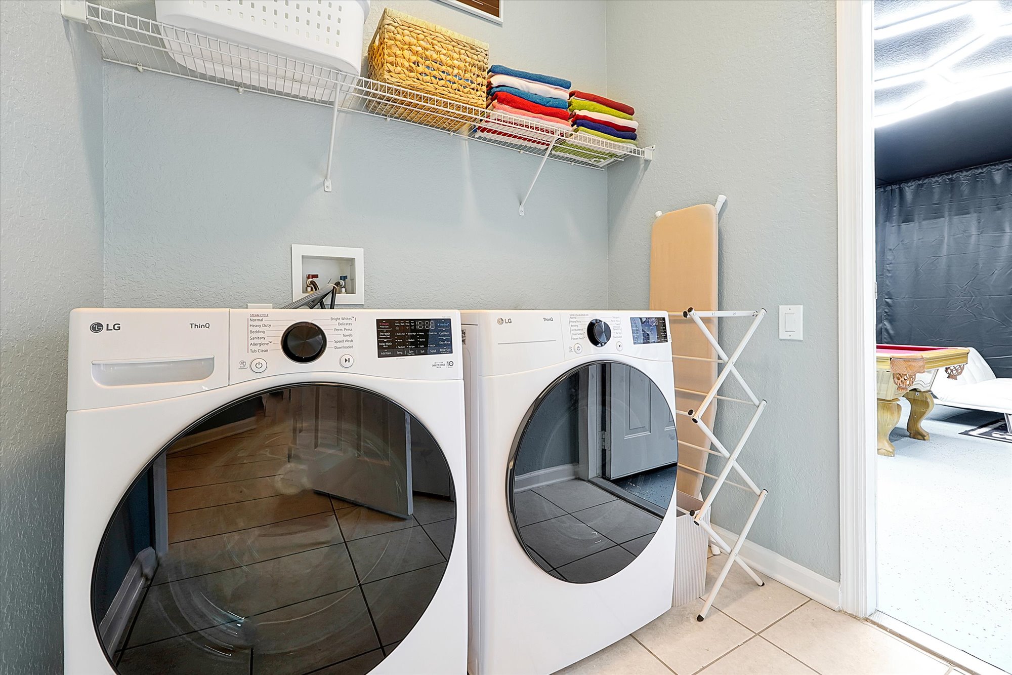 Laundry, with Iron, Ironing Board, and Drying Rack Plus Pool Towels