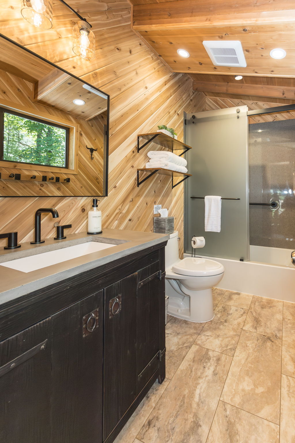 Second full bathroom with bathtub and shower combination.