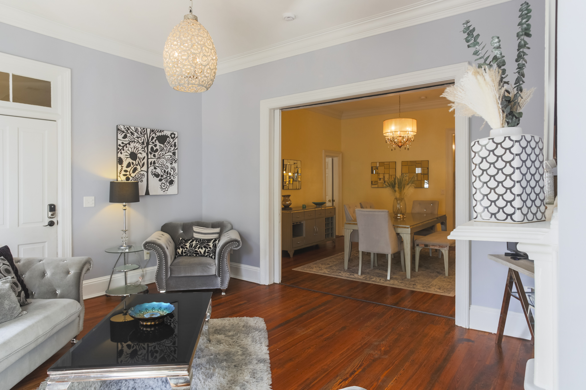 The living room flows seamlessly into the formal dining area, creating the perfect space for gathering and entertaining.