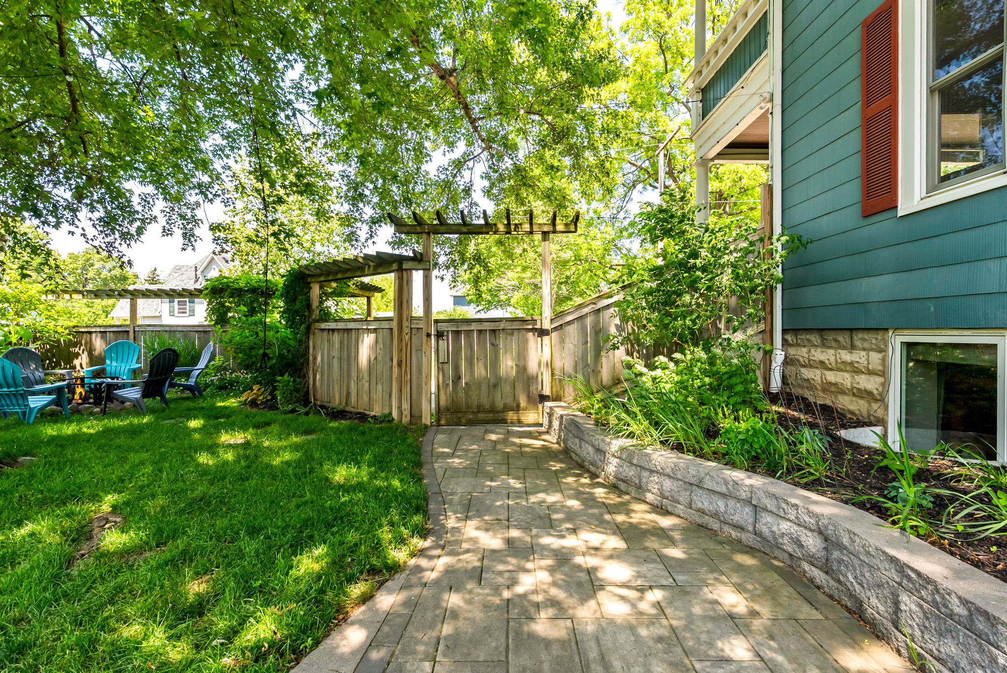 Fully enclosed and worry-free. A beautifully landscaped paver walkway runs alongside our tall privacy fence, ensuring a safe, secure boundary for dogs and kids alike.