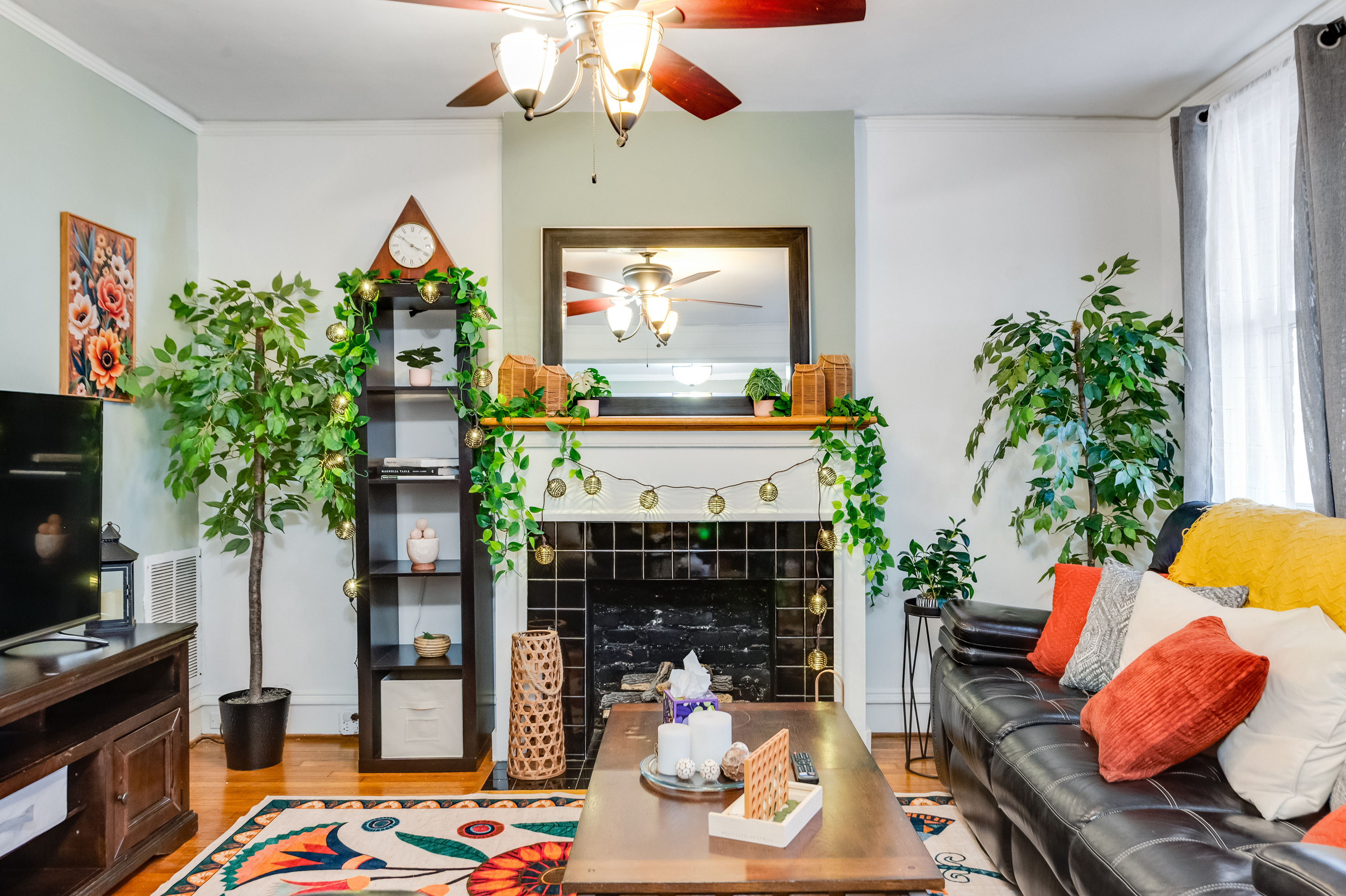 Living Room: Enjoy vibrant decor and charming greenery in this inviting space!