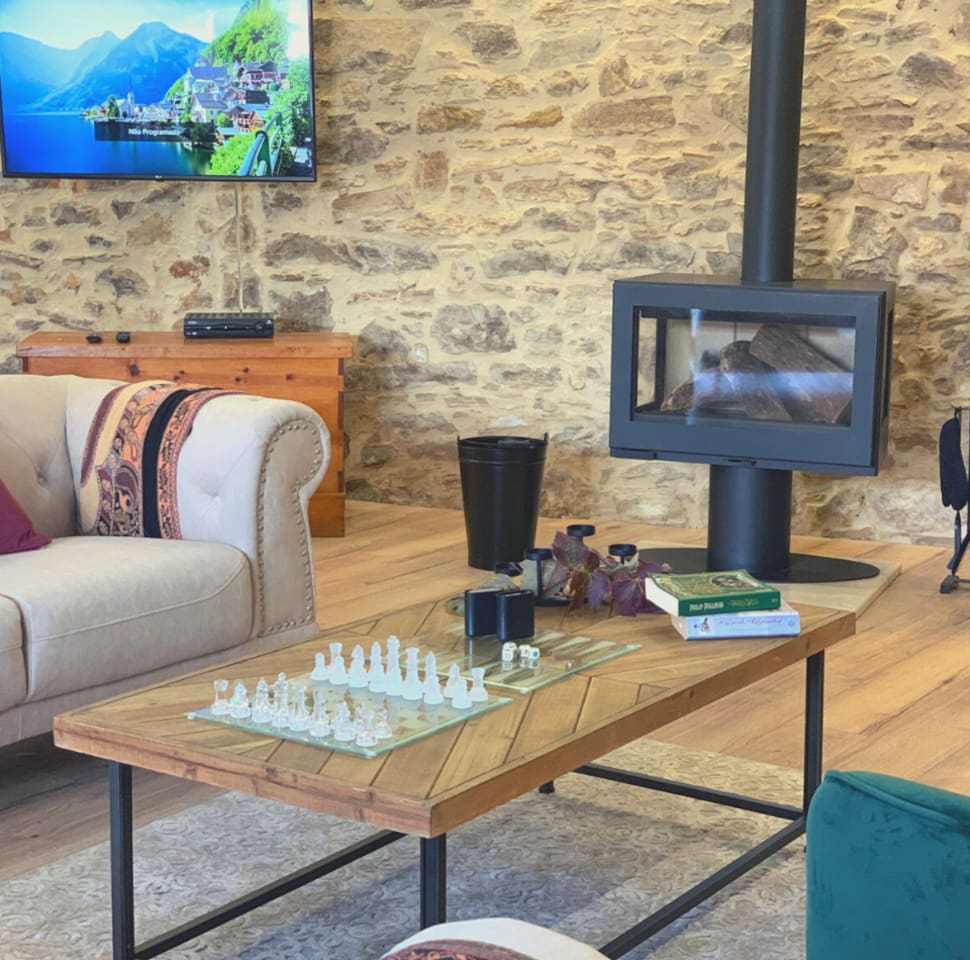 Make A Fire and Cuddle Up In This Spacious Living Room