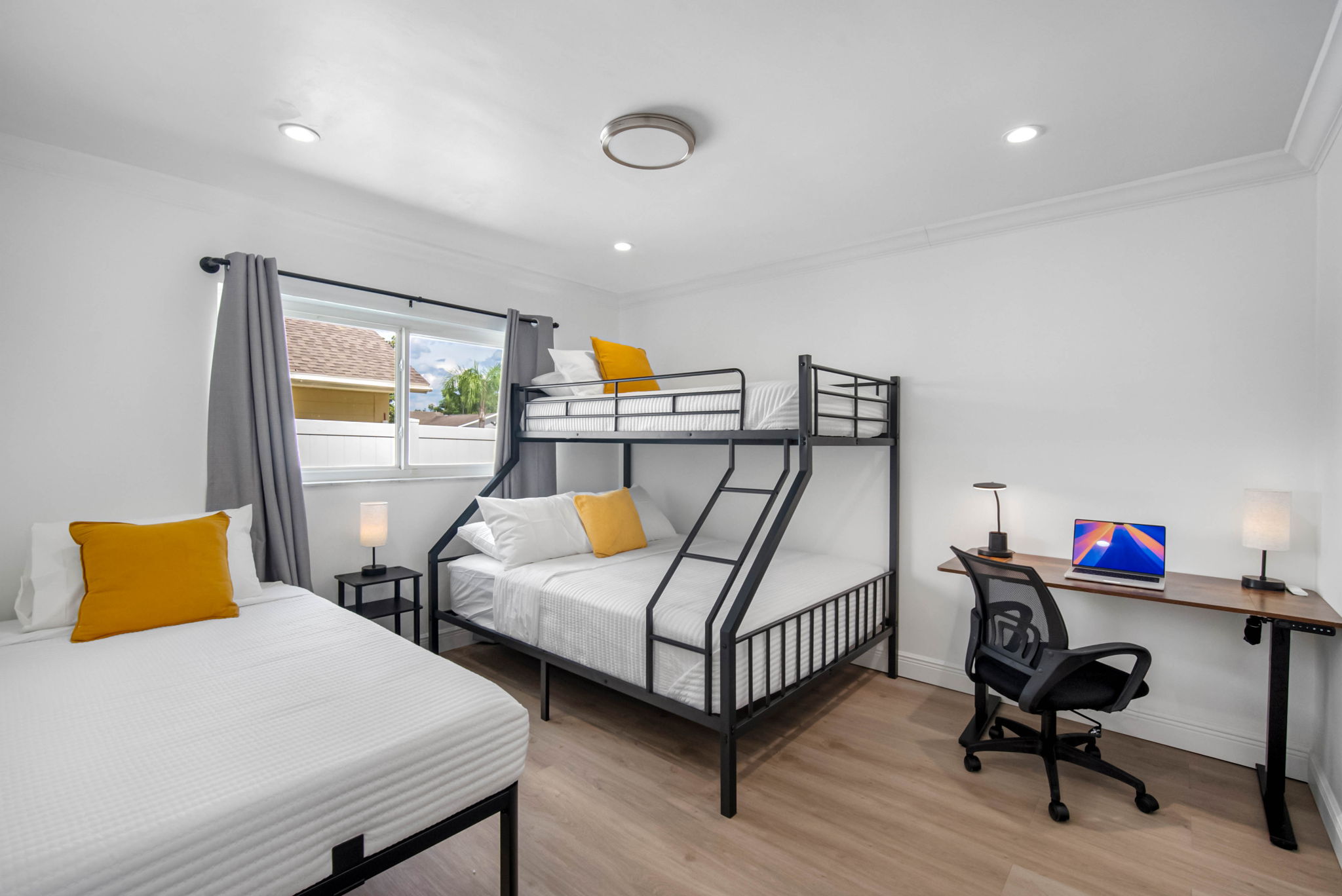 Sleep up to 4 with ease—this room features a twin bed and a twin-over-full bunk for the perfect kid or group setup.