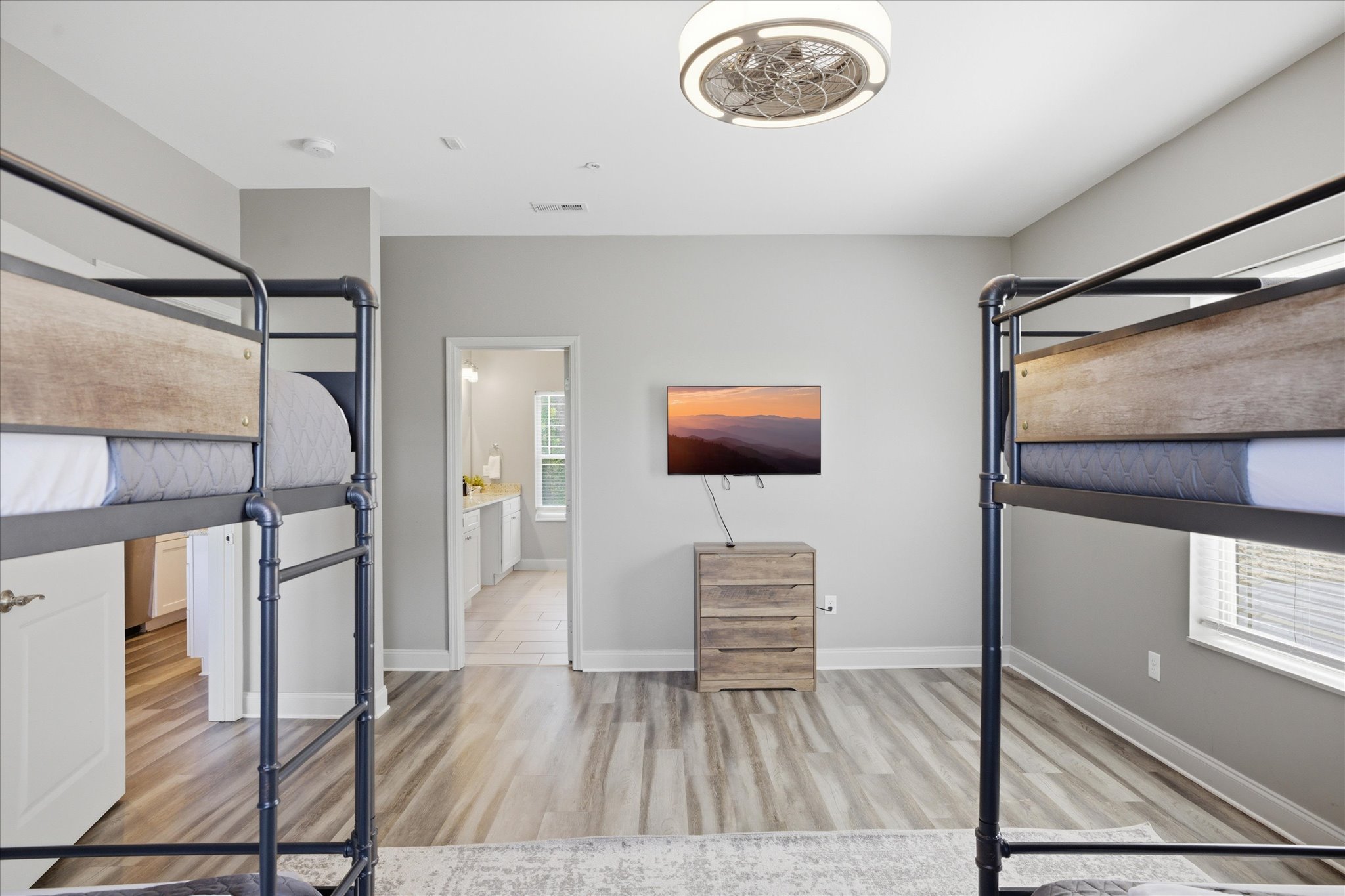 Wake up slow here—natural light, quiet mornings, and just enough space to move without stepping on each other. Whether you’re getting ready for the day or lingering a little longer, this bunk room keeps things easy and comfortable.