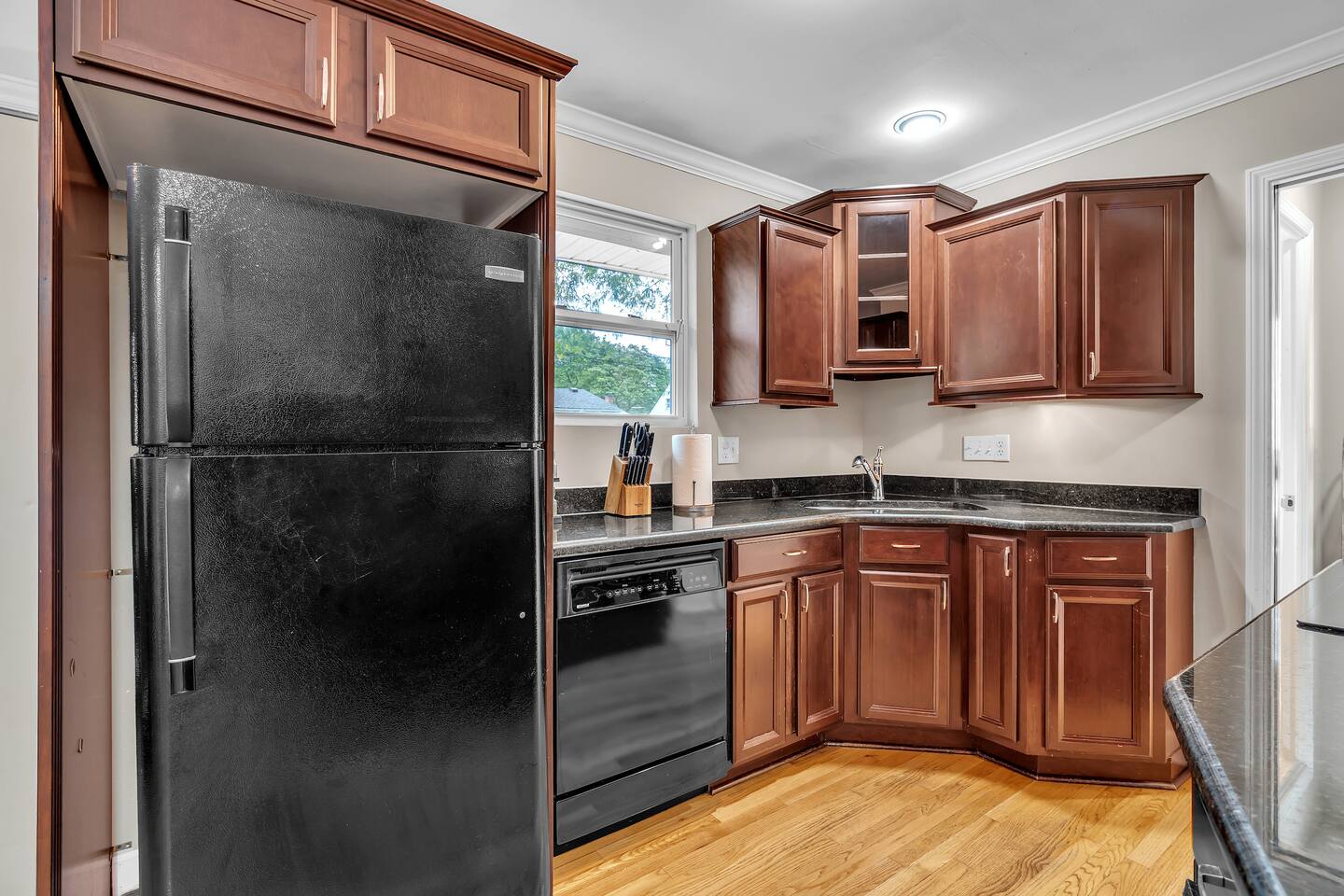 The fully equipped kitchen with granite countertops is ready for your MasterChef skills.
