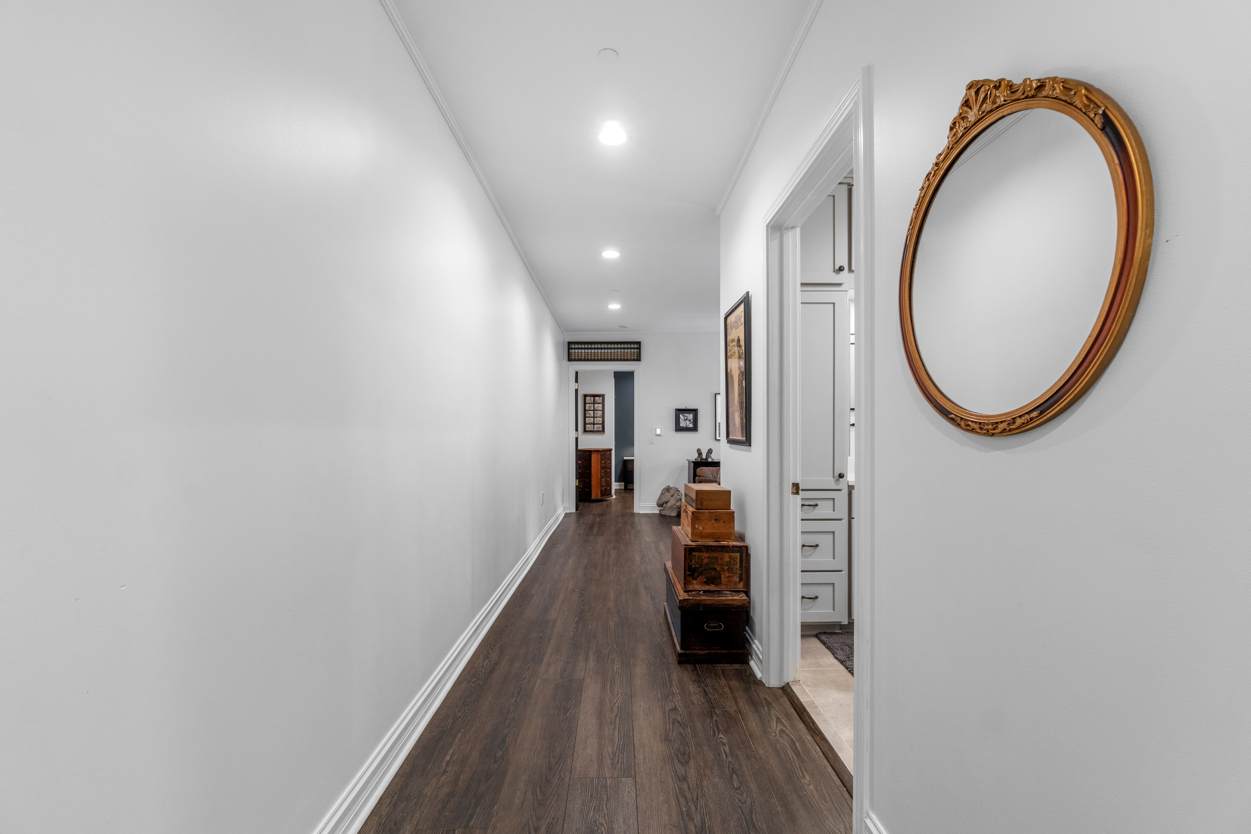 Hallway to full bath, living room, and bedroom