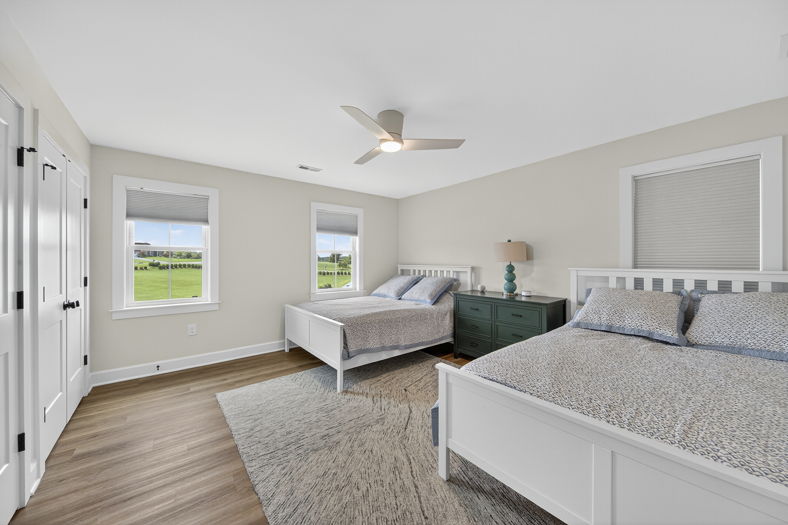 Roomy and restful, this guest room includes two queen beds and plenty of space.