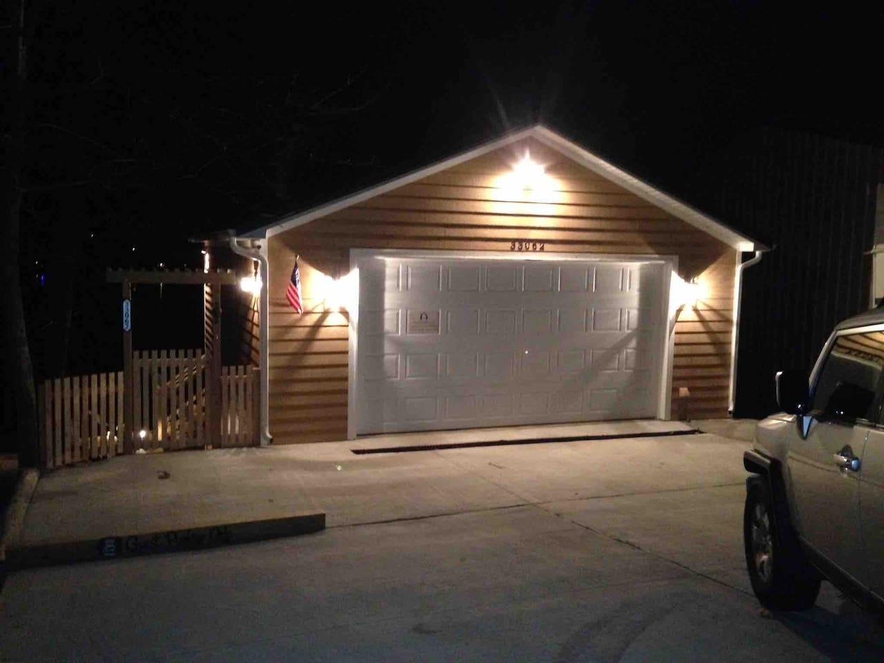 Well lit concrete driveway with reserved parking space for you. 