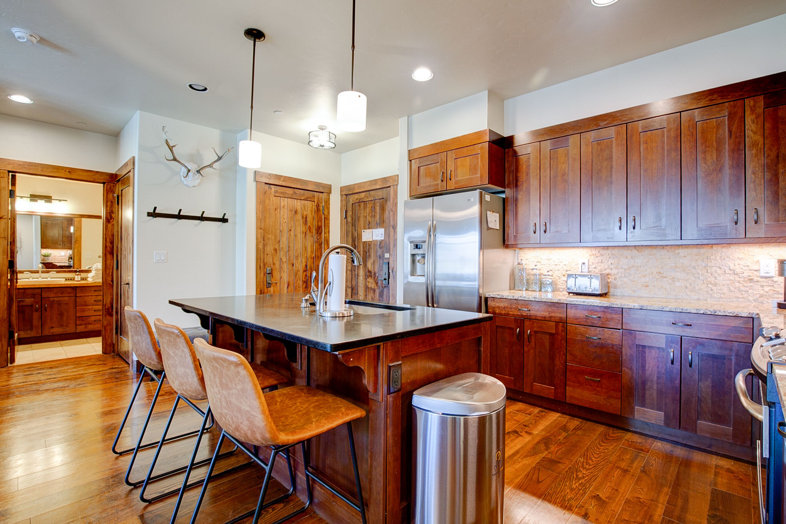 Well appointed kitchen with dishwasher in large island.