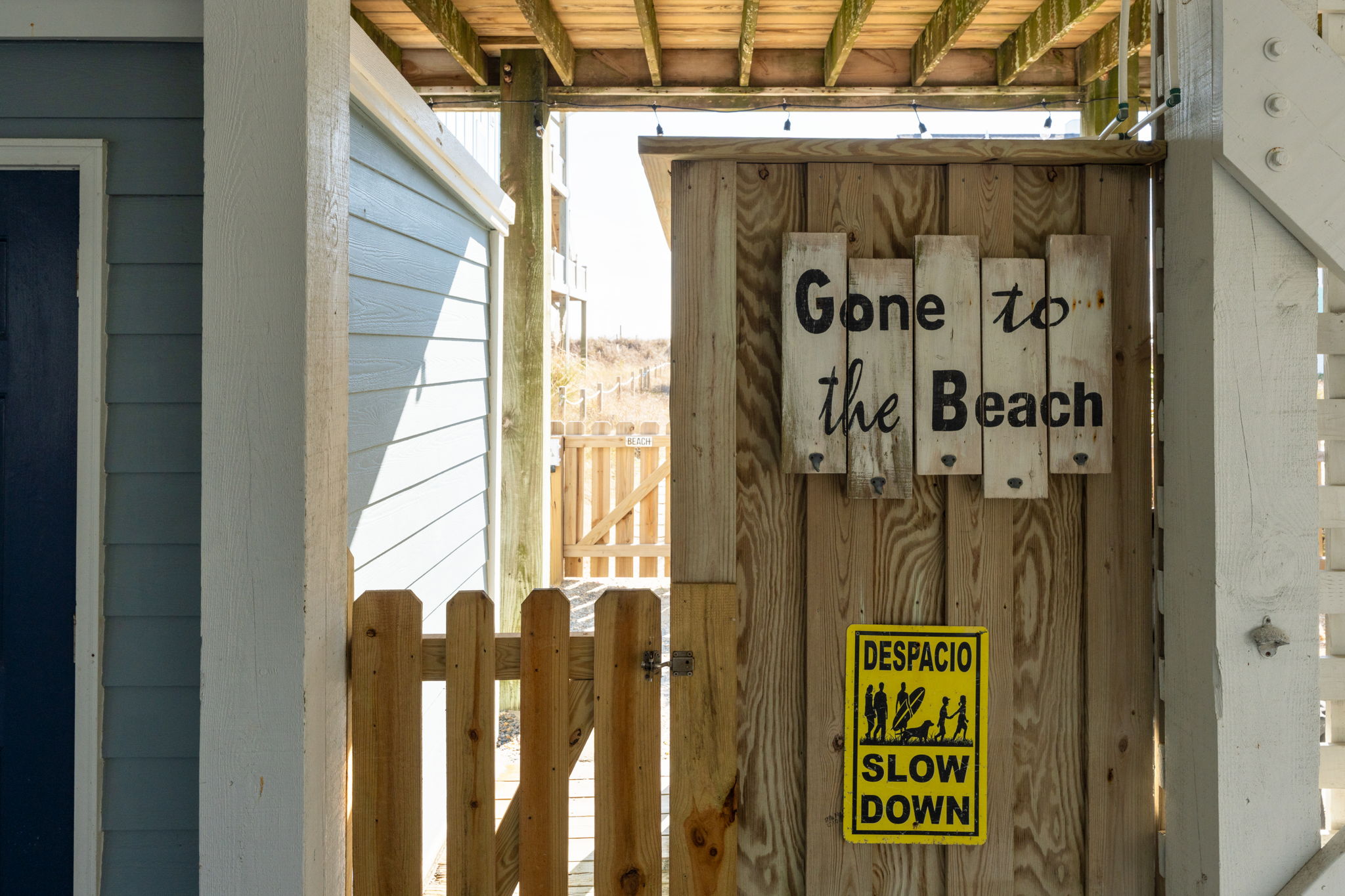 Access to the small fenced in area from the carport