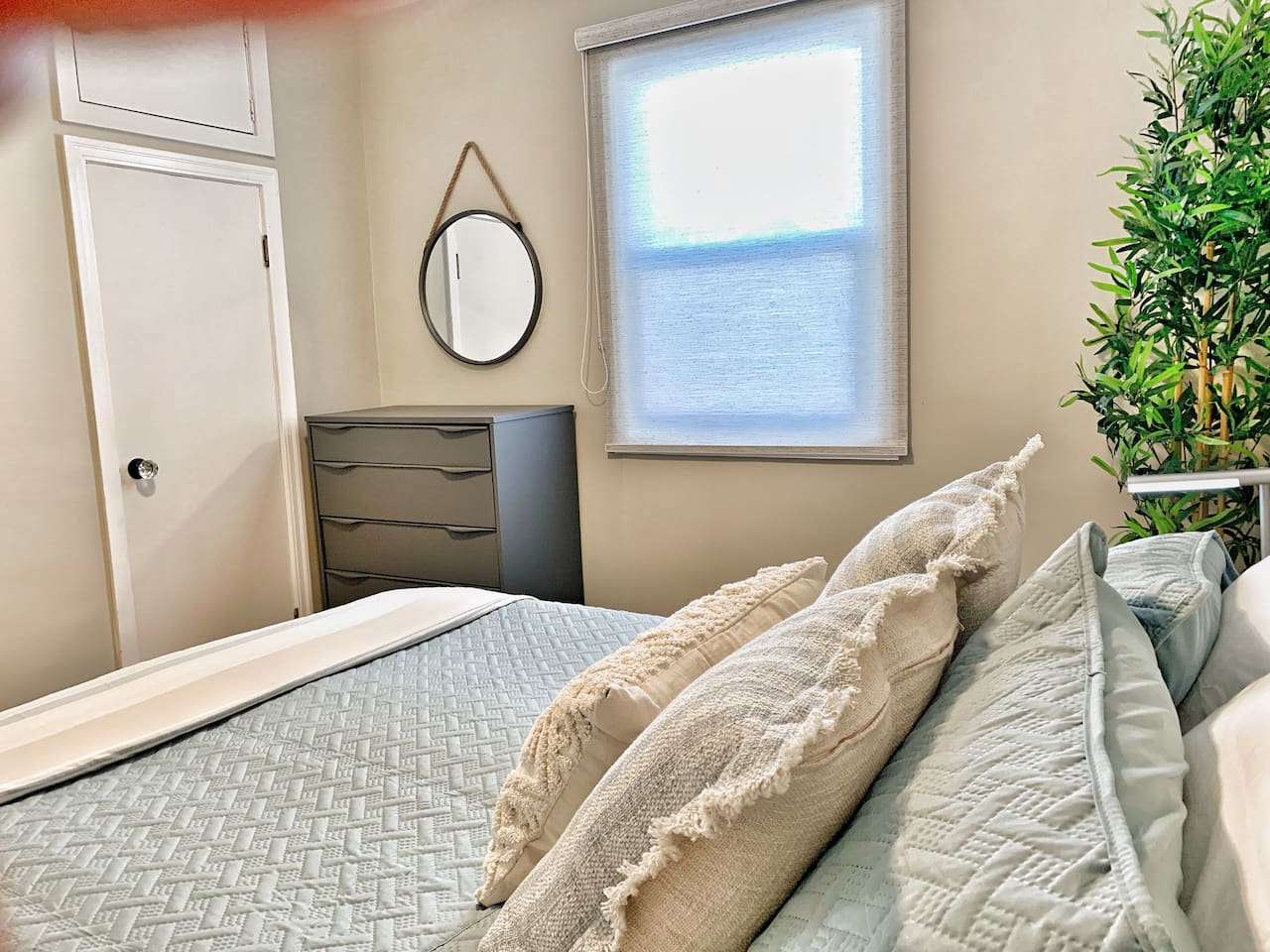 Cozy Second Bedroom with Comfortable Bedding & Warm, Neutral Décor