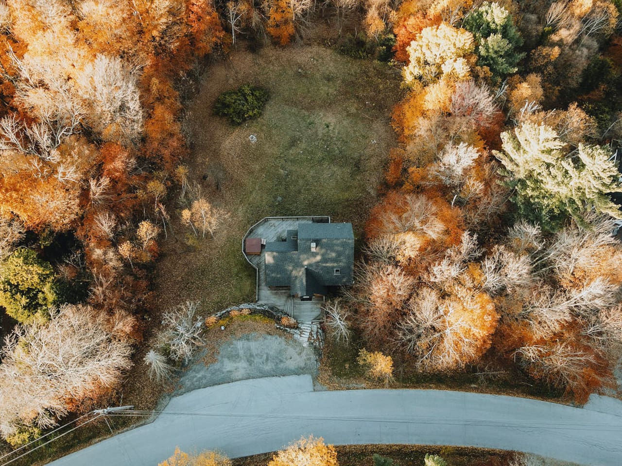 Aerial view of the house and property during foliage season