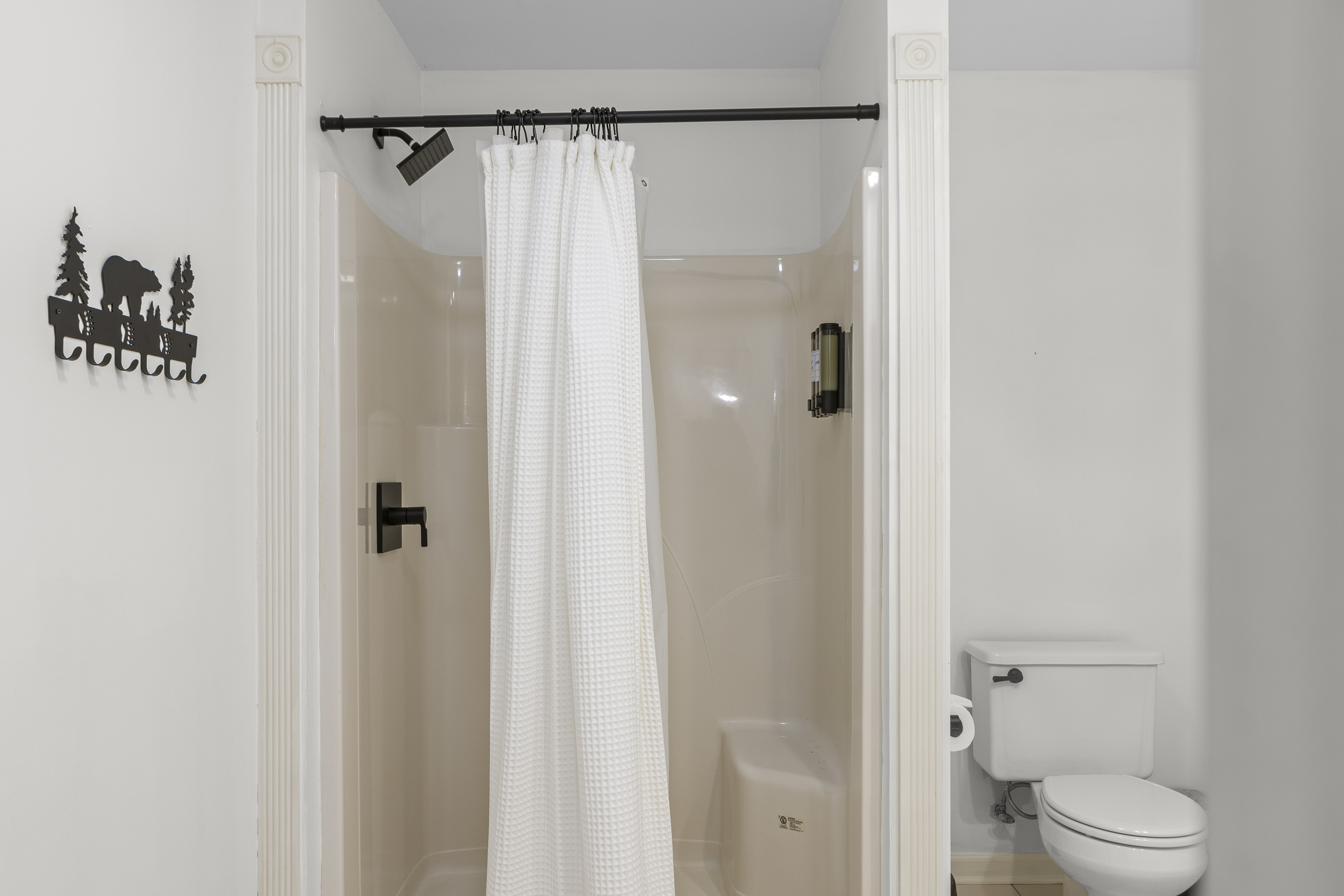 Full Bathroom 1: Refresh in style with sleek finishes and a whimsical bear-themed decor!