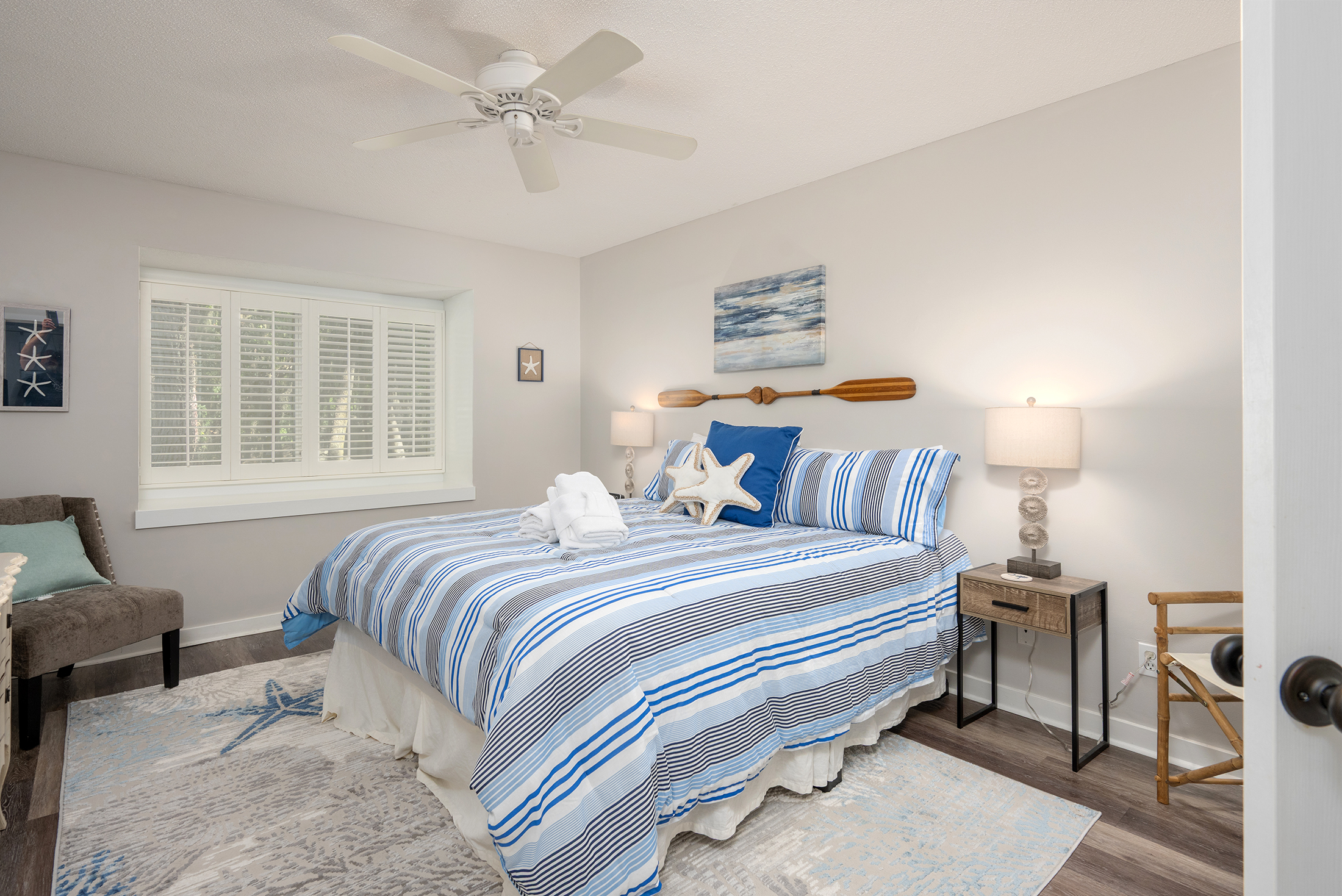 Primary bedroom features a king-size bed