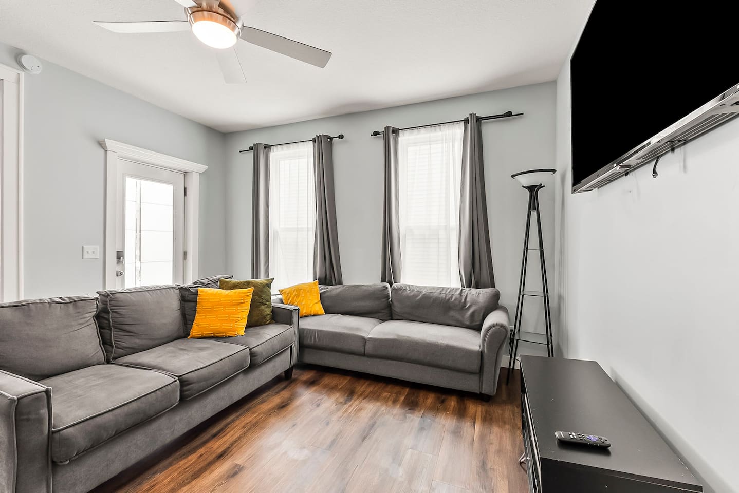 Enjoy downtime in the living room with plenty of seating, entertainment setup.