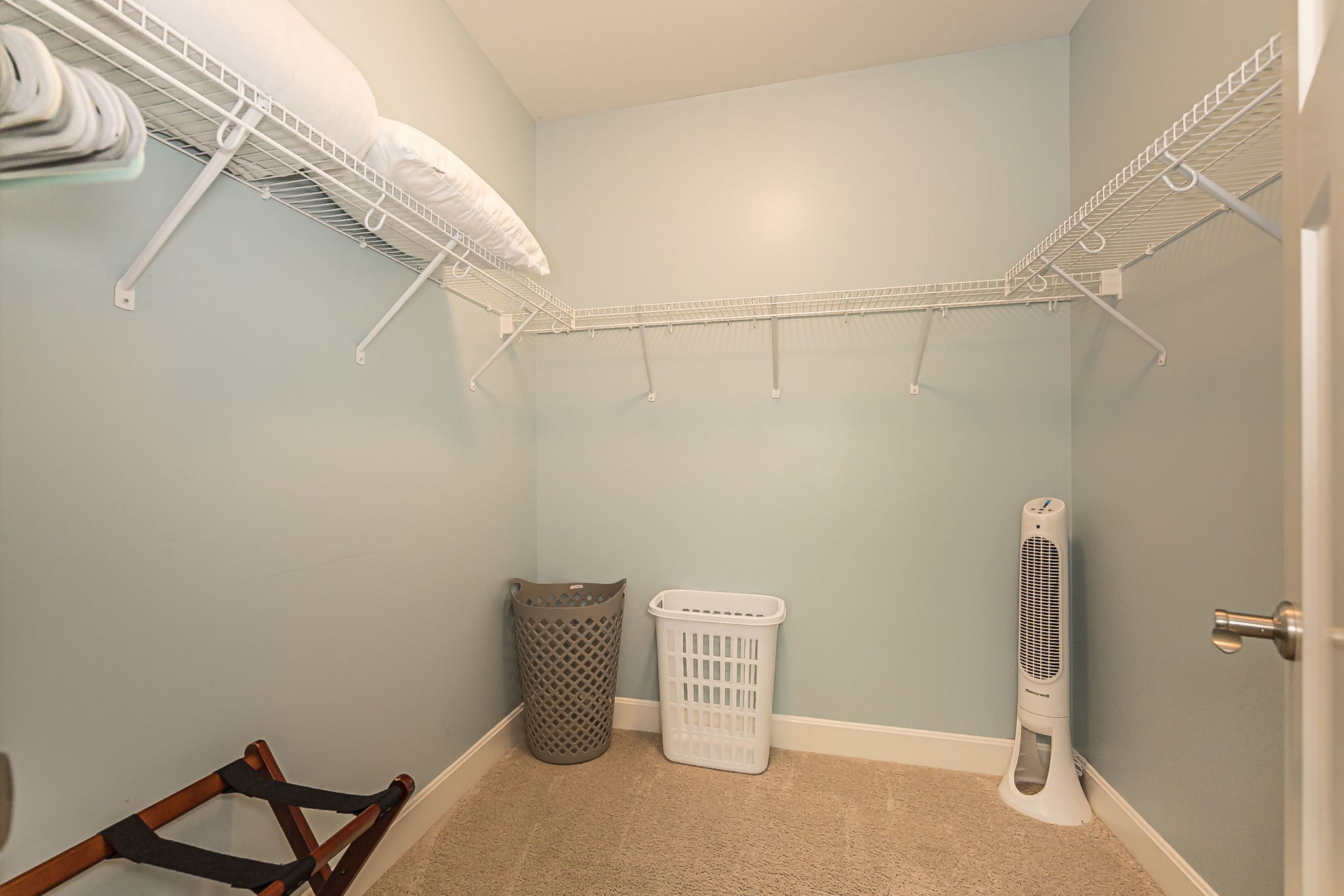 Each bedroom has a blanket, fan, luggage rack, hangers, and hampers.