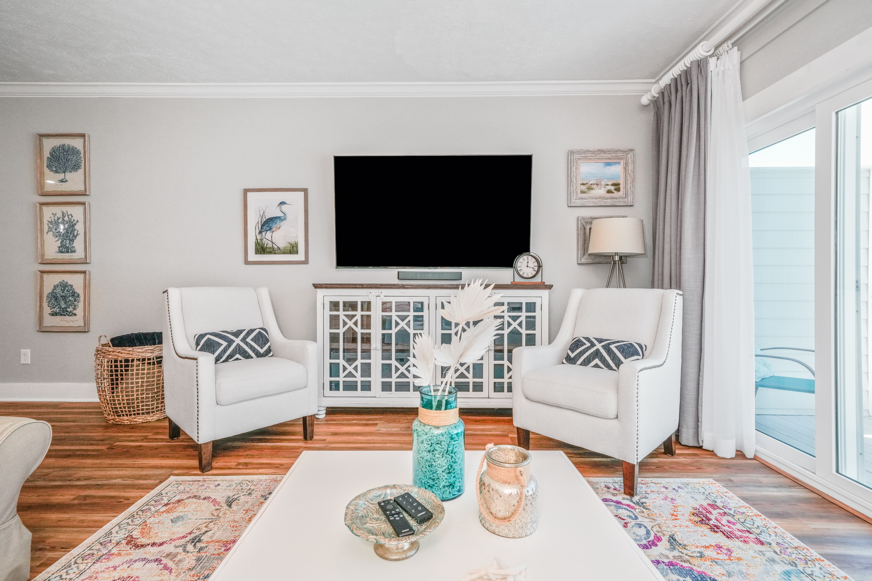 Modern entertainment area with oversized Smart TV, comfortable sofas, and plenty of space to relax.