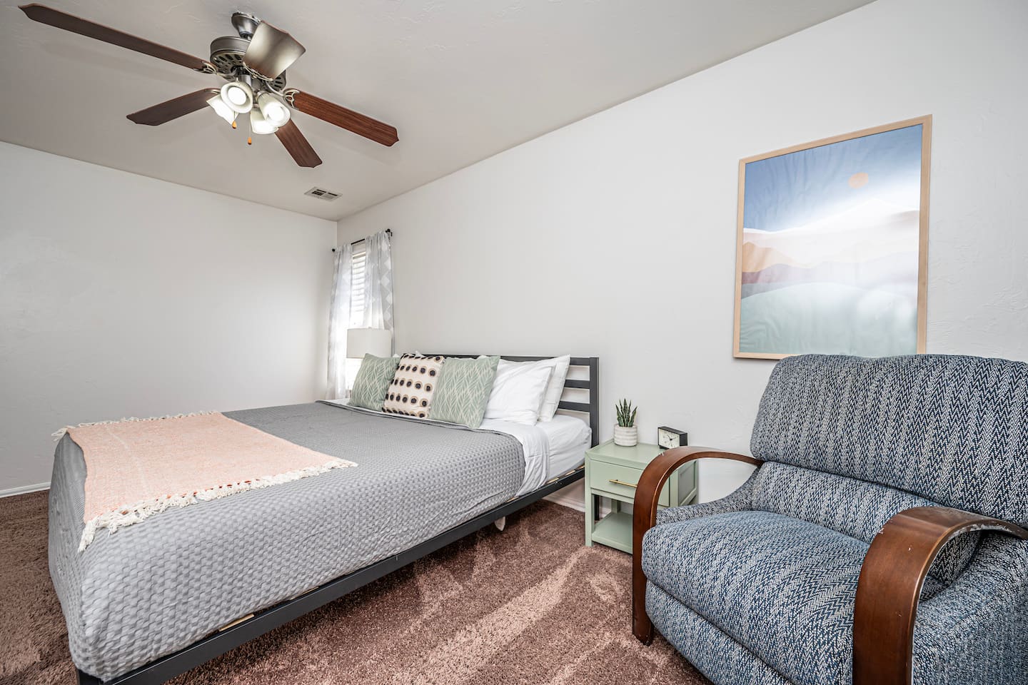 Unwind in your private retreat—master bedroom with a plush king bed.