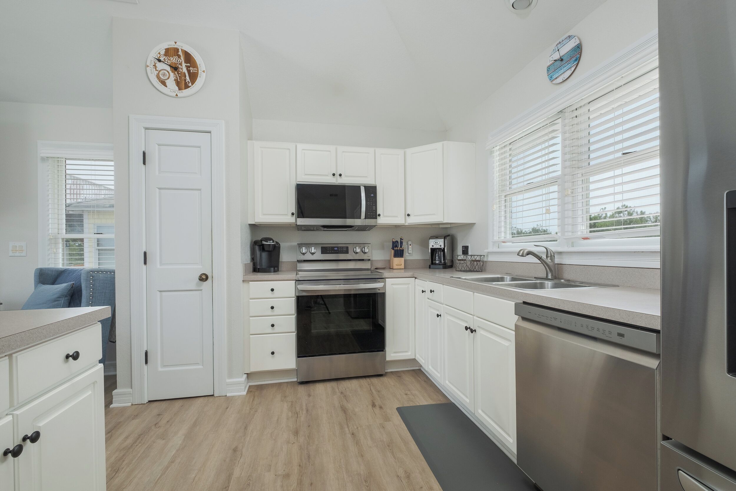 Modern, open-concept kitchen with island for cooking or casual dining.