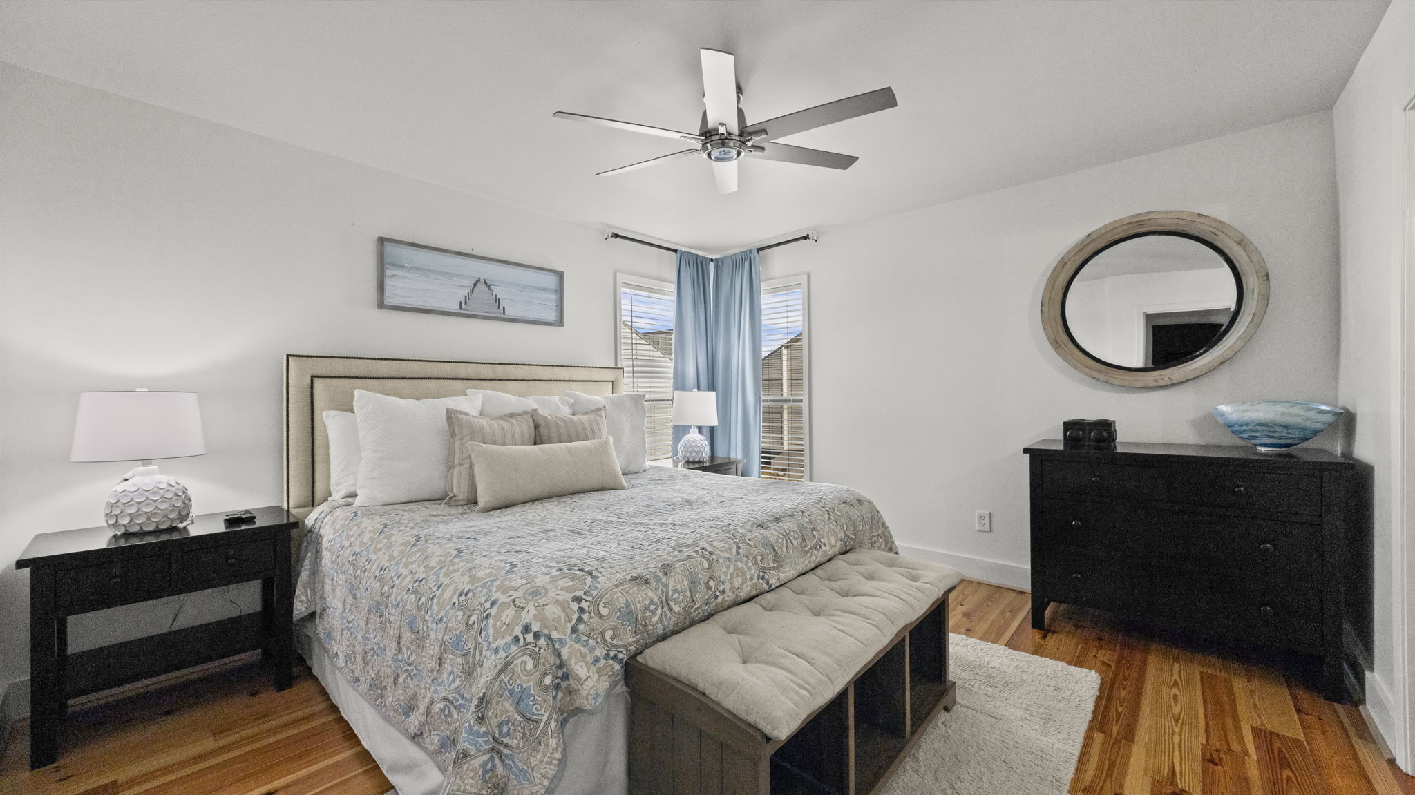 Relax in the spacious master suite of our Cotton Bayou condo, complete with cozy bedding, updated coastal decor, and a private en suite. This tranquil retreat offers plenty of space to unwind after a day by the sparkling pool or exploring the bay