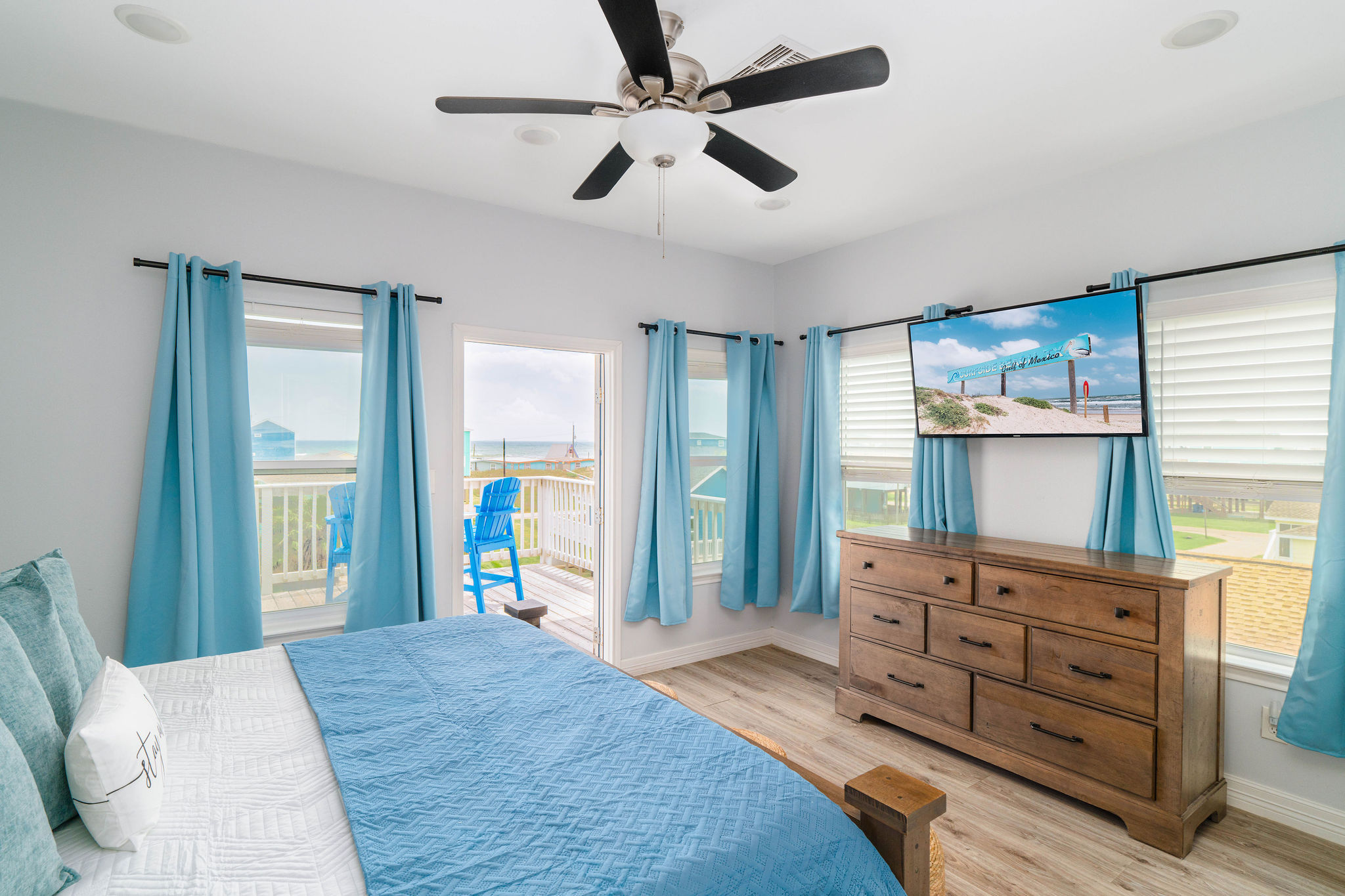 Master Suite upstairs — King bed, 55" TV, ensuite bath, private deck with a Gulf view. Your morning coffee spot.