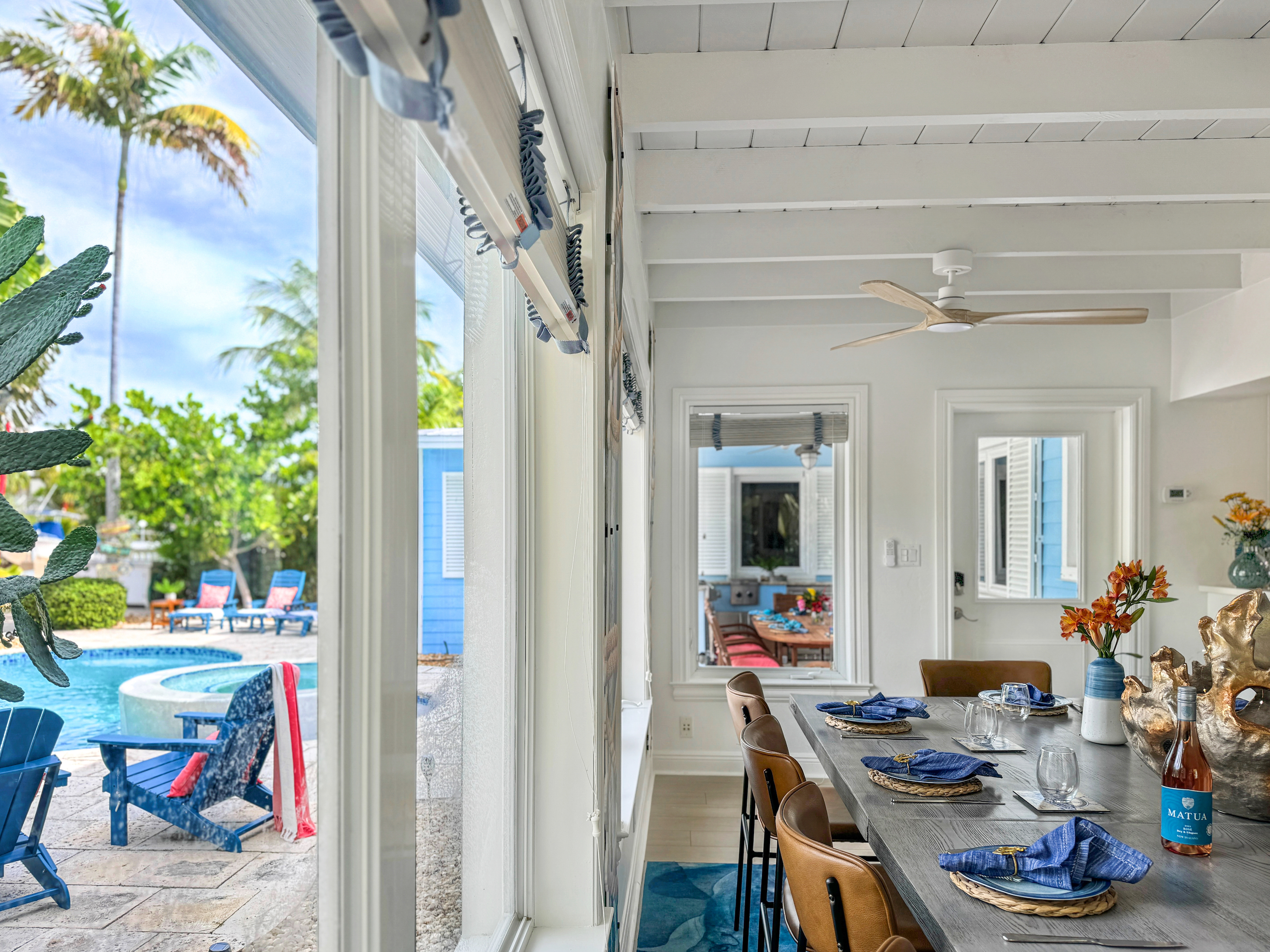 The dining are aopens up to the backyard pool.