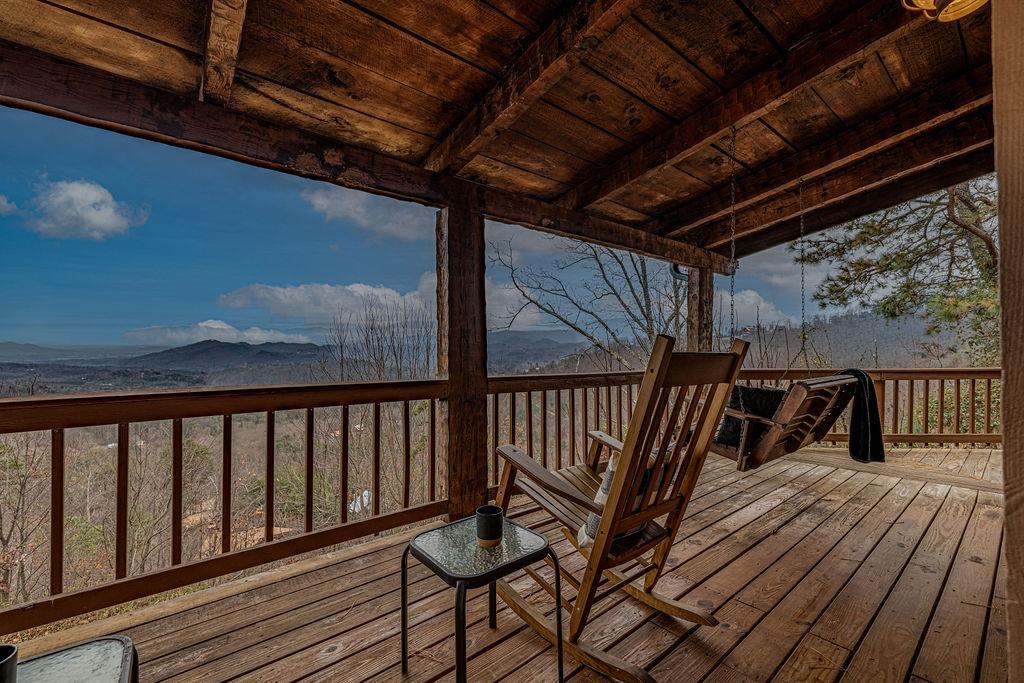 Covered deck with rockers and mountain views