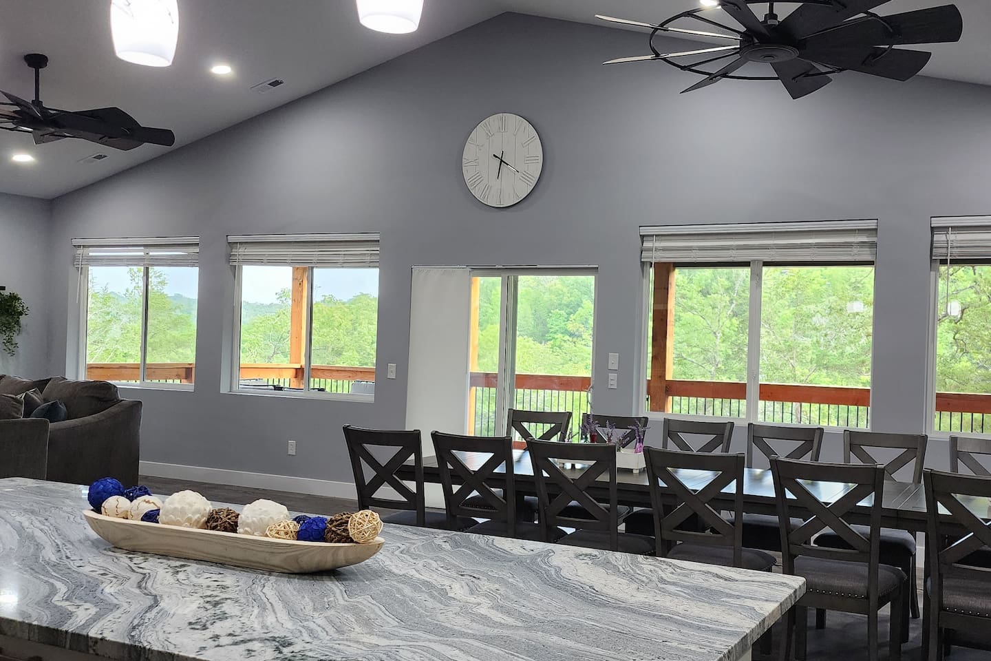 Spacious dining and gathering space with beautiful wooded views.