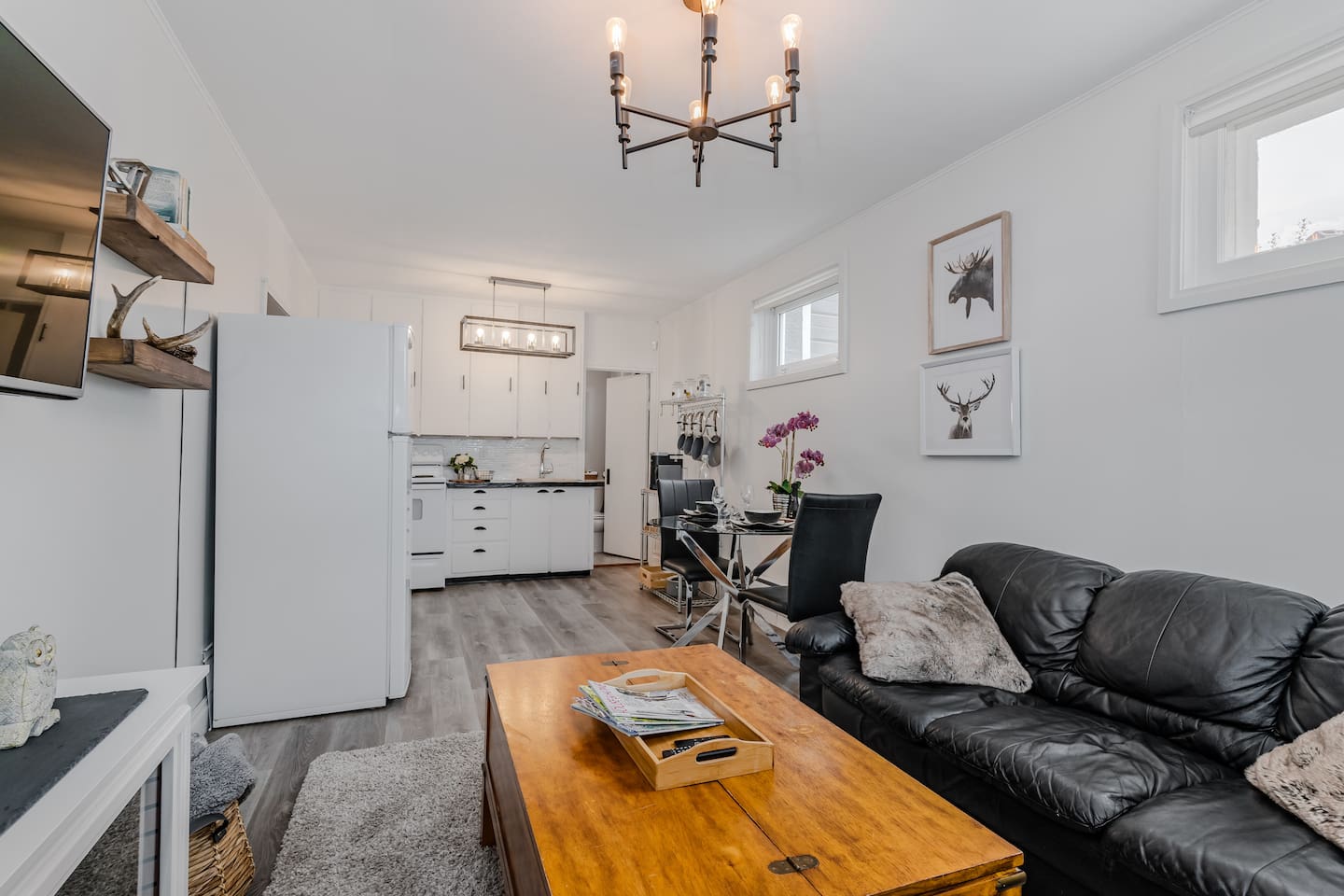 This functional kitchen has a full-size stove and fridge and dining area, offering everything you need for a comfortable stay.