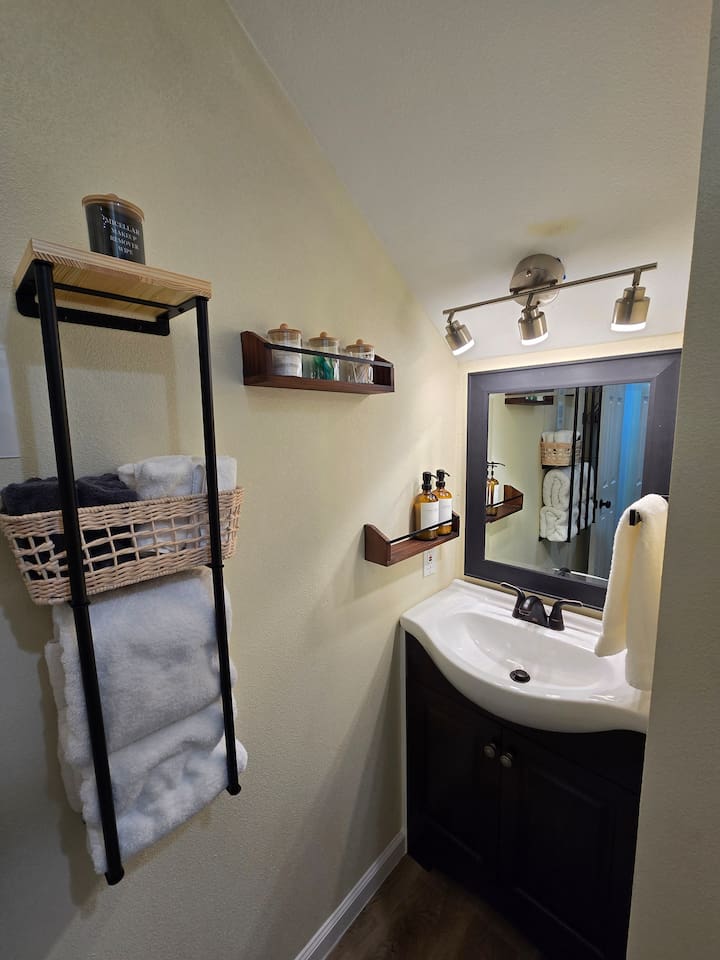 Upstairs bathroom. Step stool for children in the vanity cabinet.